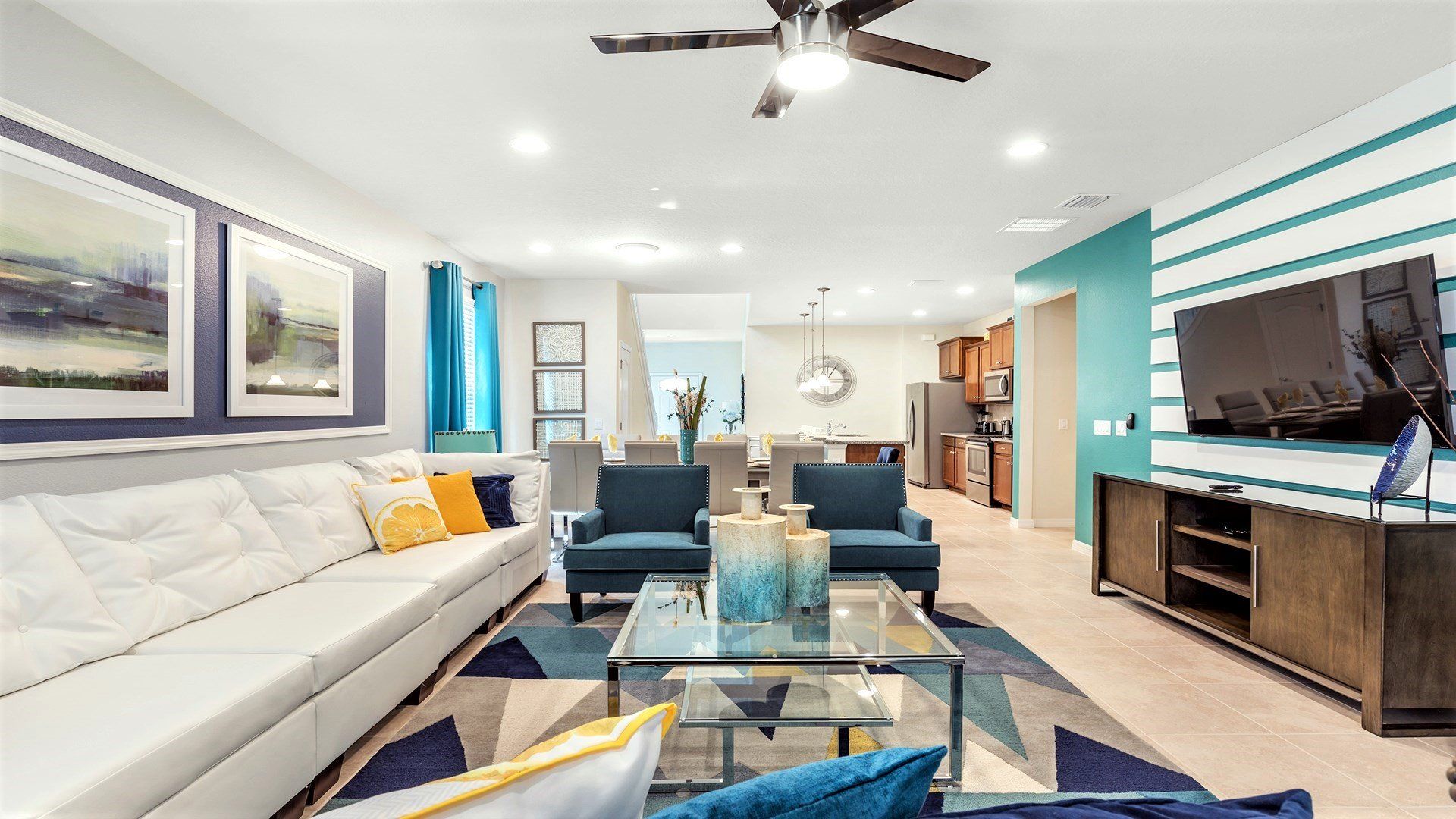 Vibrant open living space with modern decor, smart TV, and cozy seating.