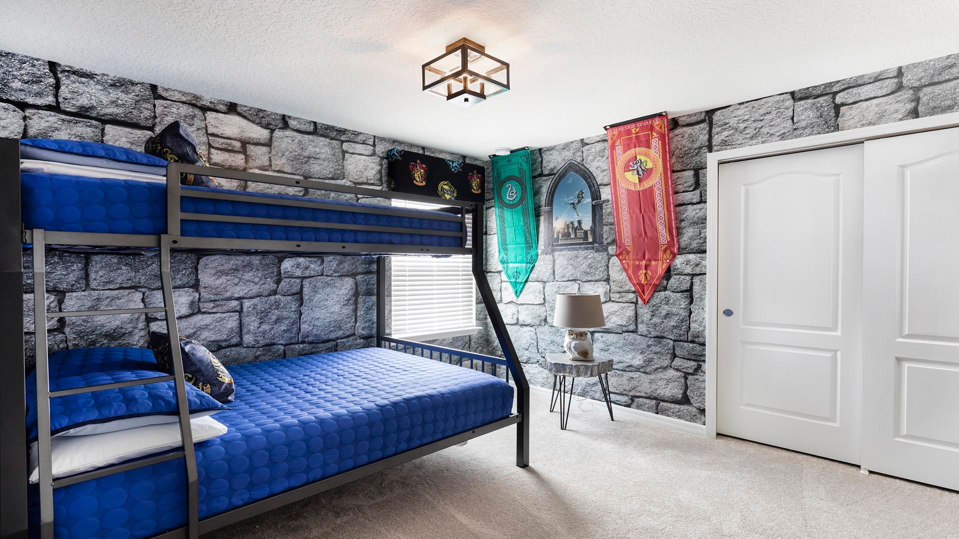 Wizard-themed bedroom with bunk beds, castle walls, and house banners!