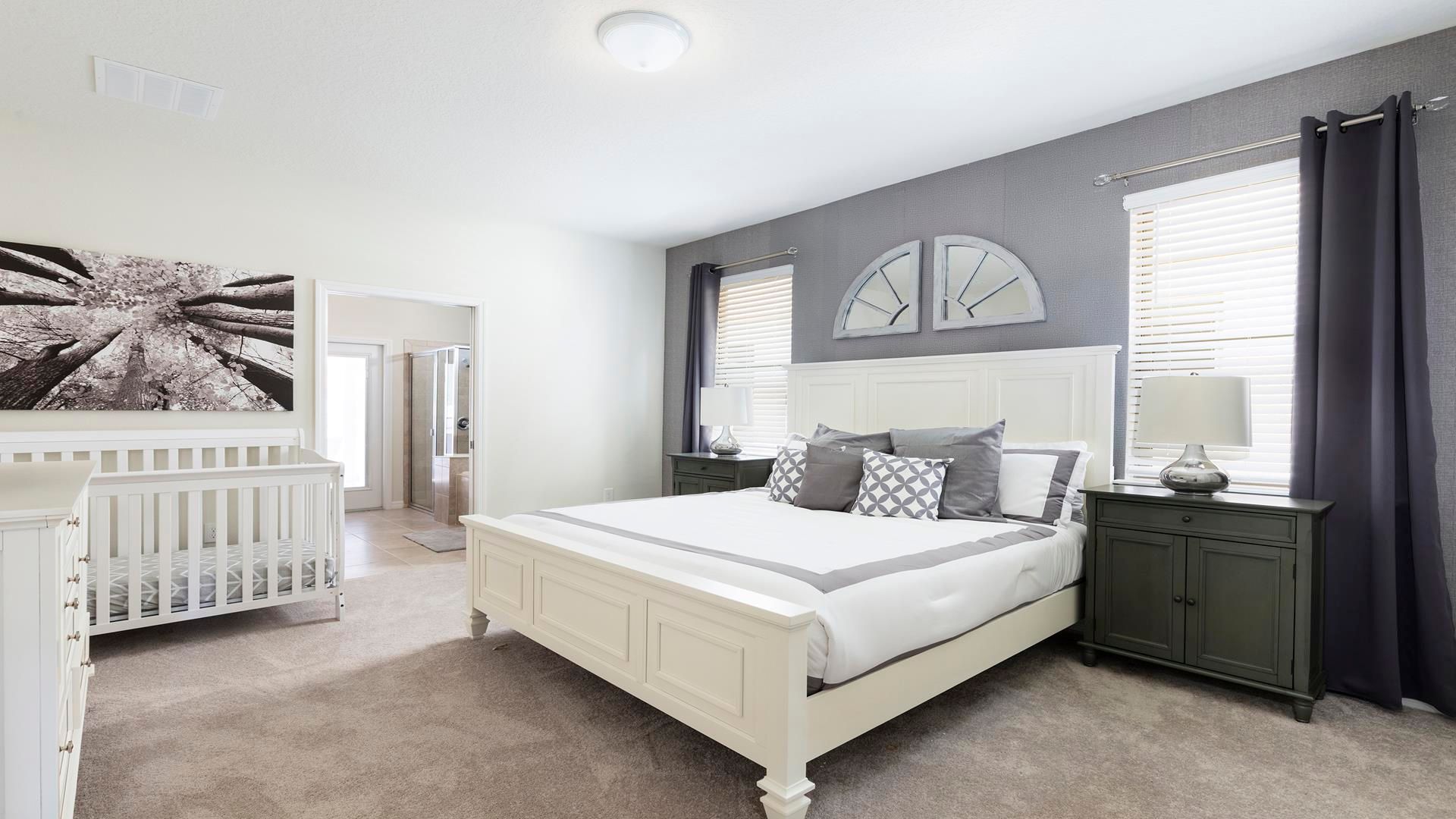 Charming master suite with king bed, nursery space, and en-suite!