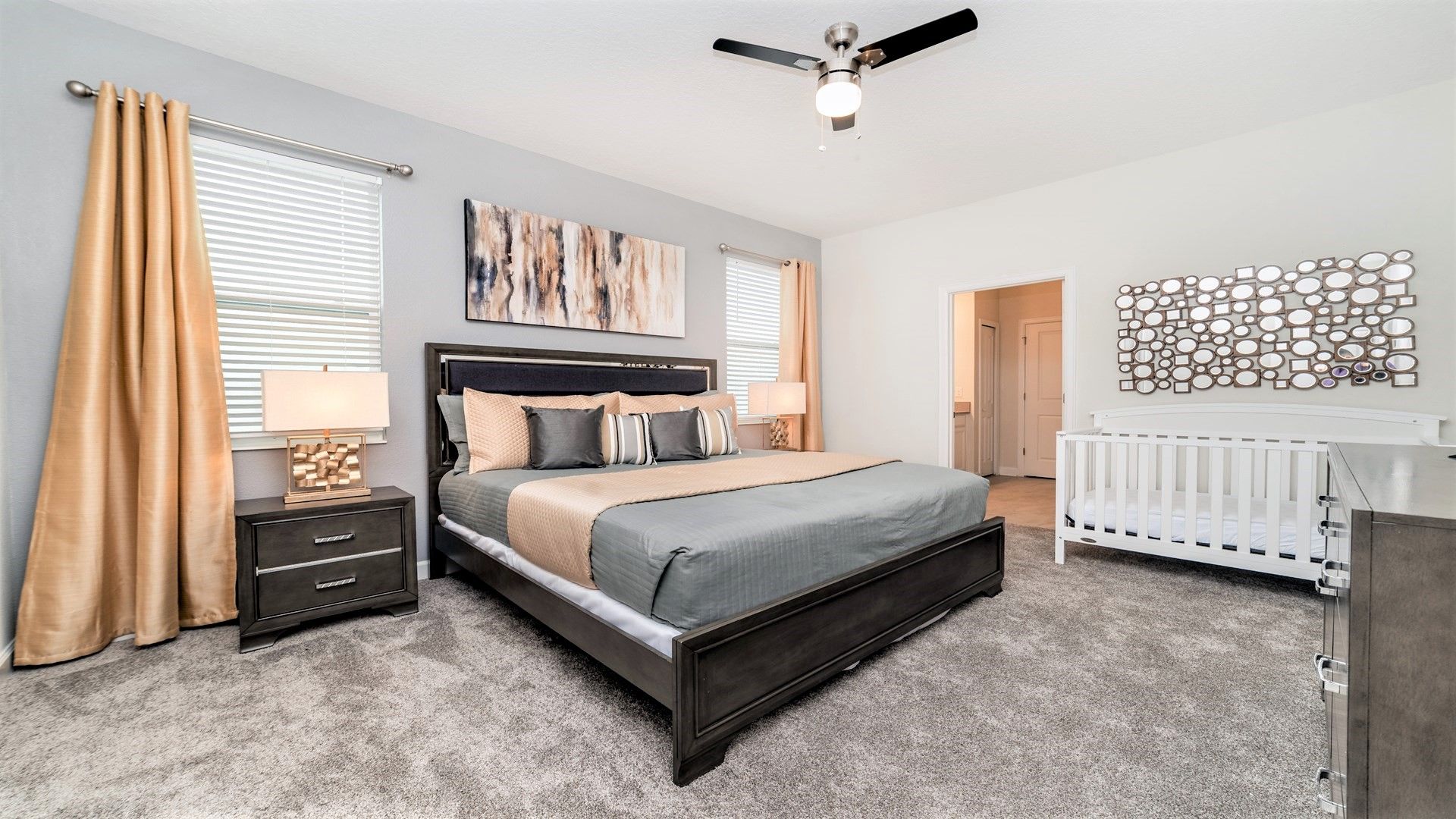 Spacious master suite with king bed, stylish decor, and a crib!
