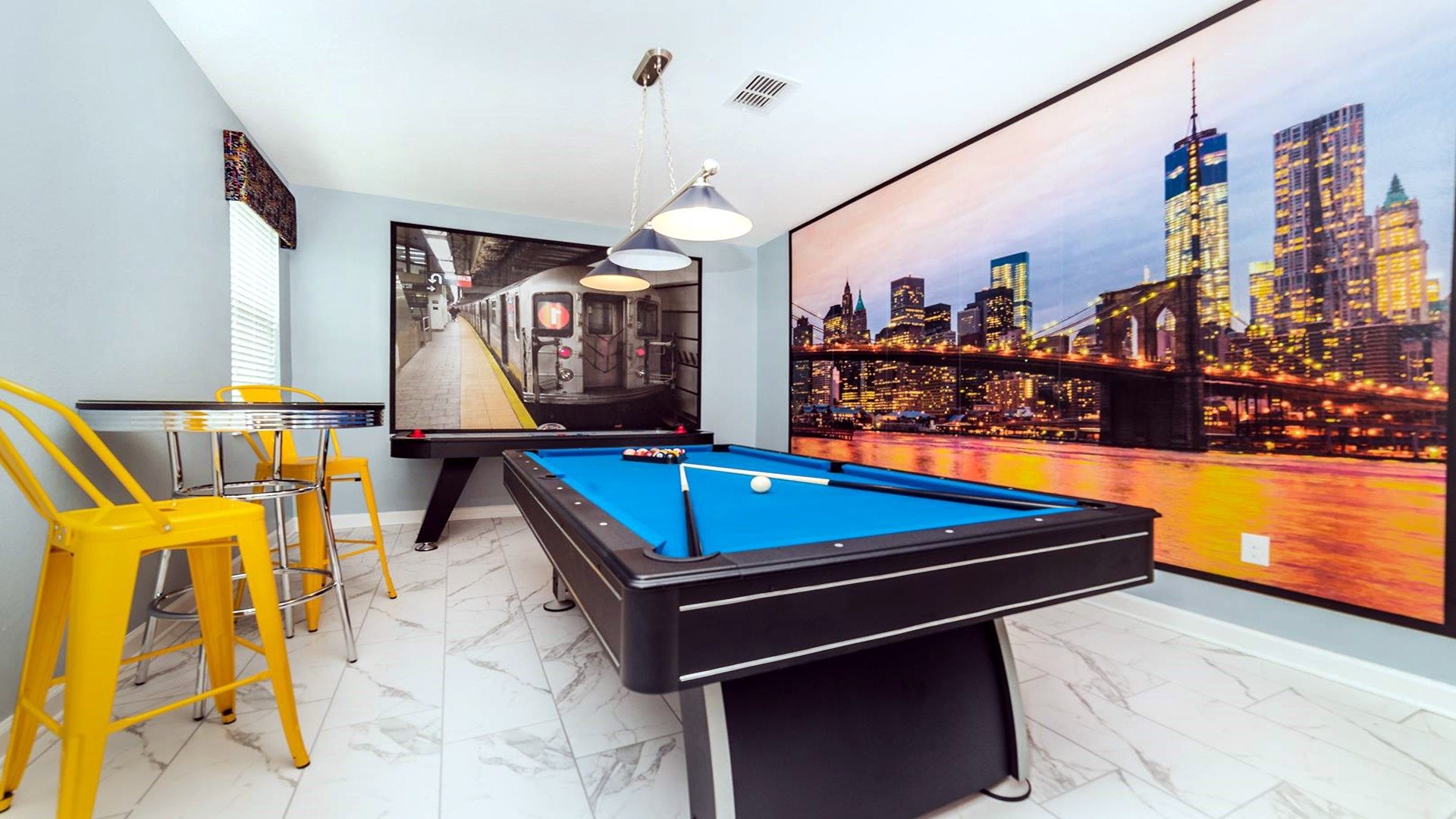 Fantastic game room with pool table for kids and adults.