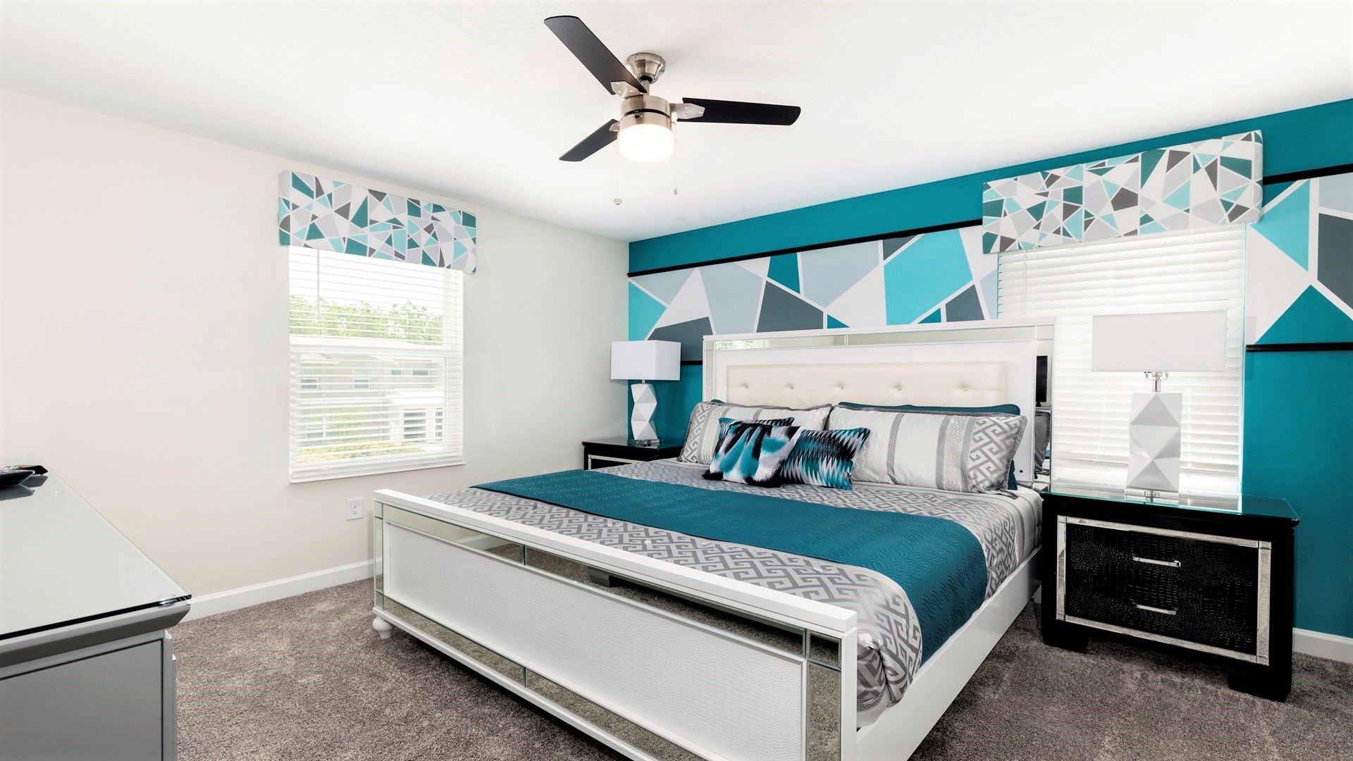 Modern bedroom with king bed, bold geometric accents, and style!