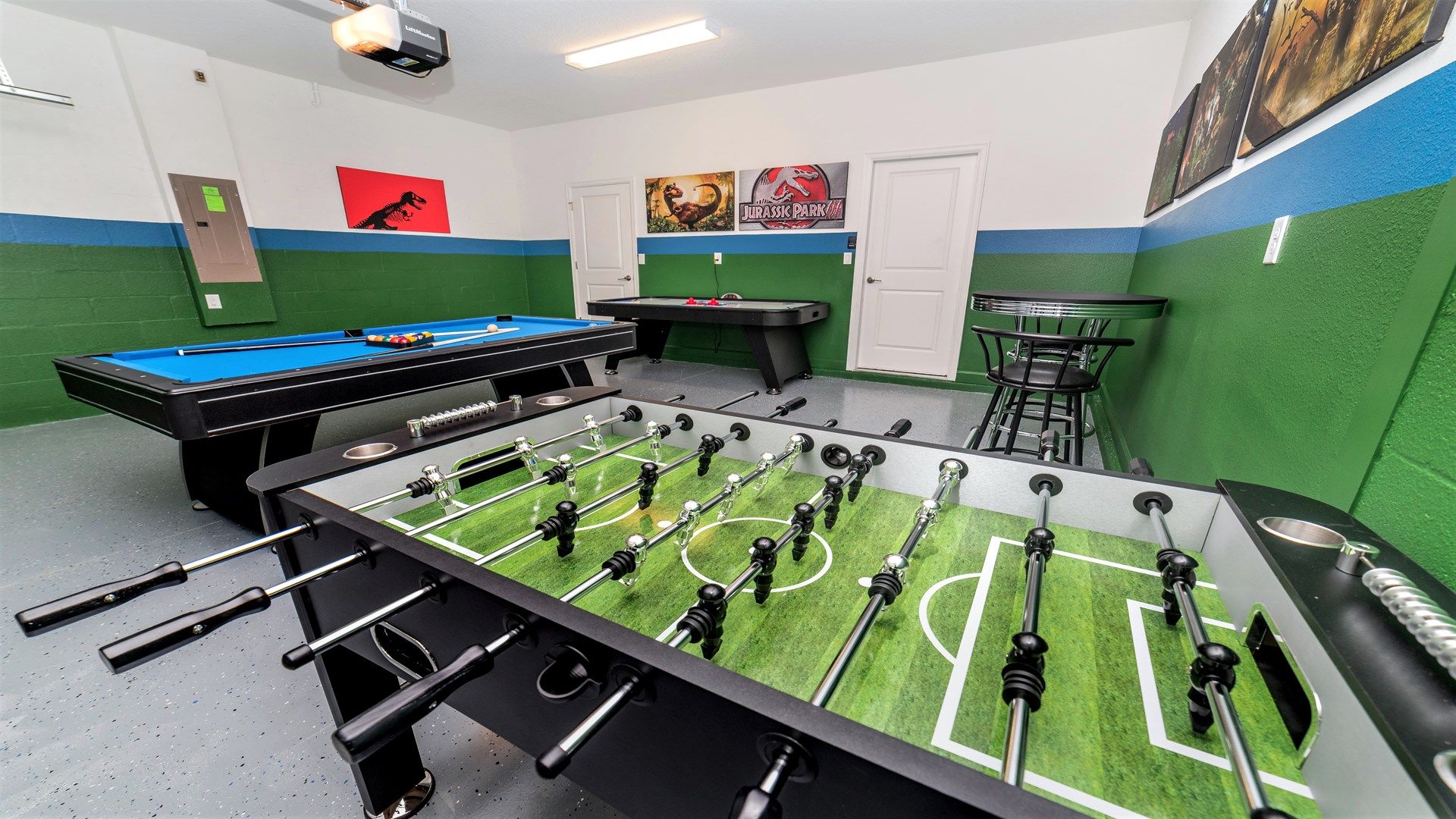 Exciting game room with foosball, air hockey, and pool table.