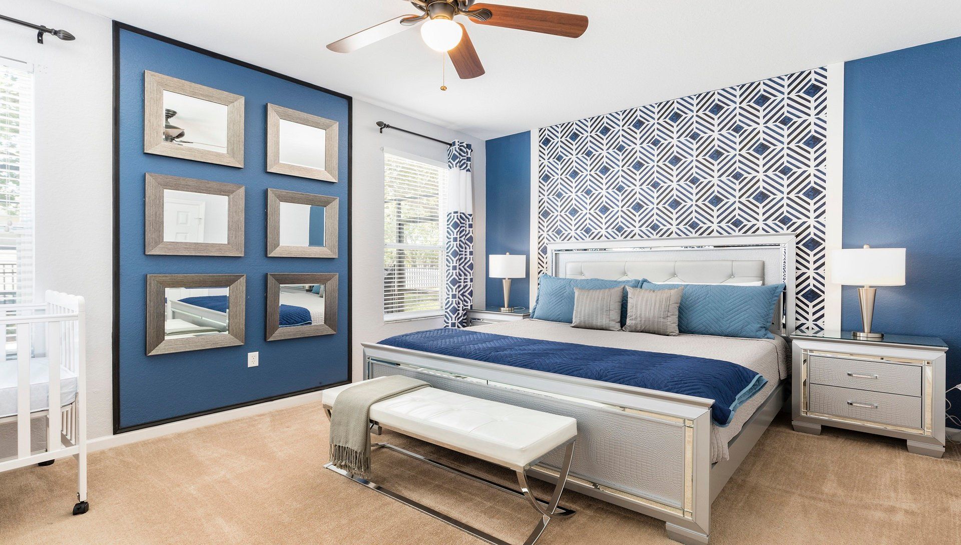 The master bedroom on the ground floor with a luxuriously large king bed