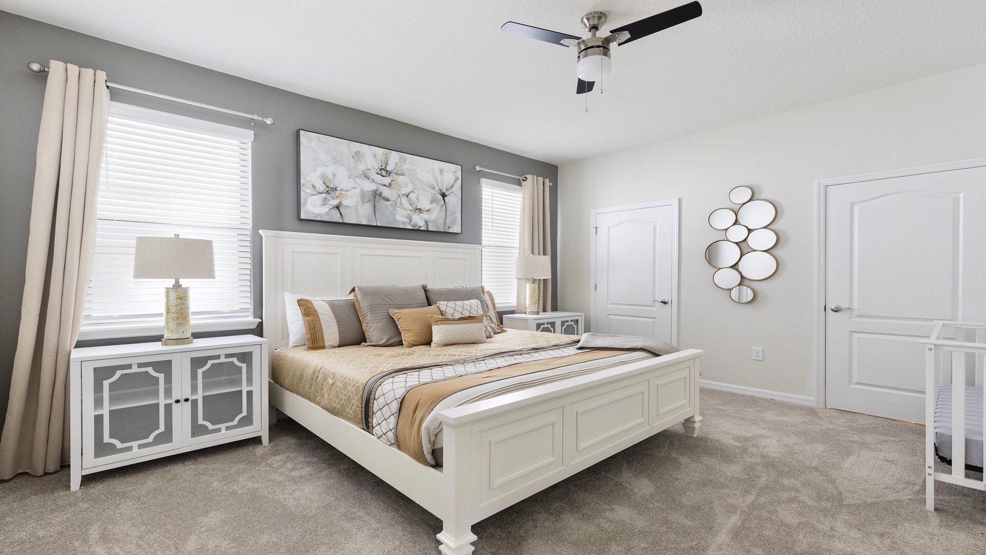 Charming coastal-themed bedroom with soothing decor and a serene view of the lake through the window.