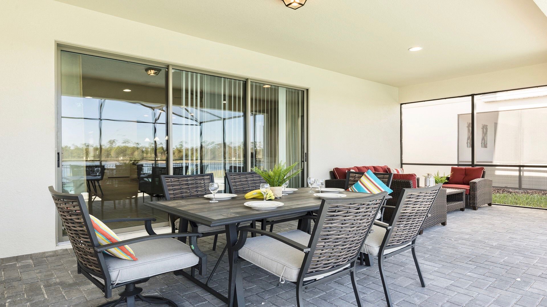 Cozy outdoor seating with plush red cushions, perfect for relaxing and enjoying the fresh air.