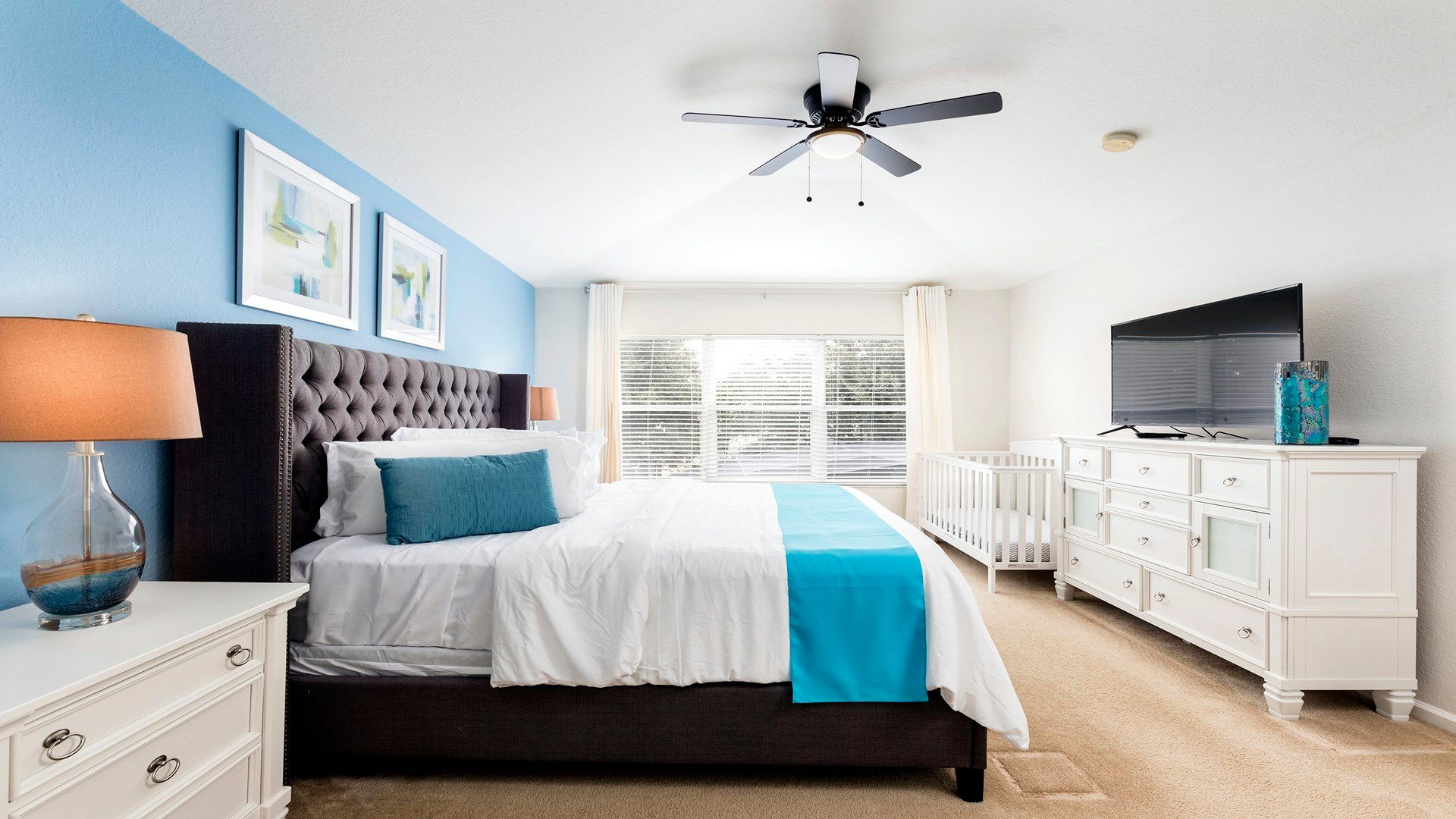 The master bedroom on the ground floor with a luxuriously large king bed