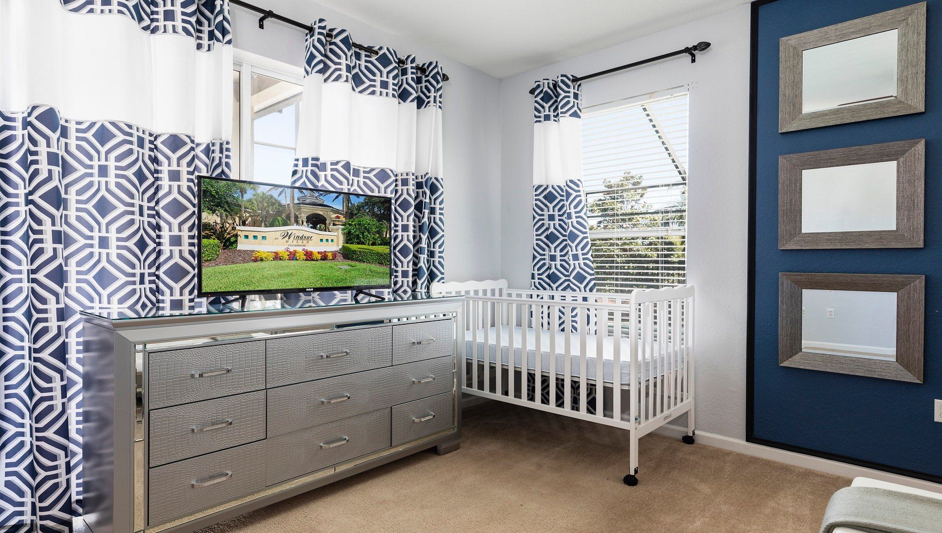 Chic, cozy space with a crib, stylish decor, natural light, and modern comforts.