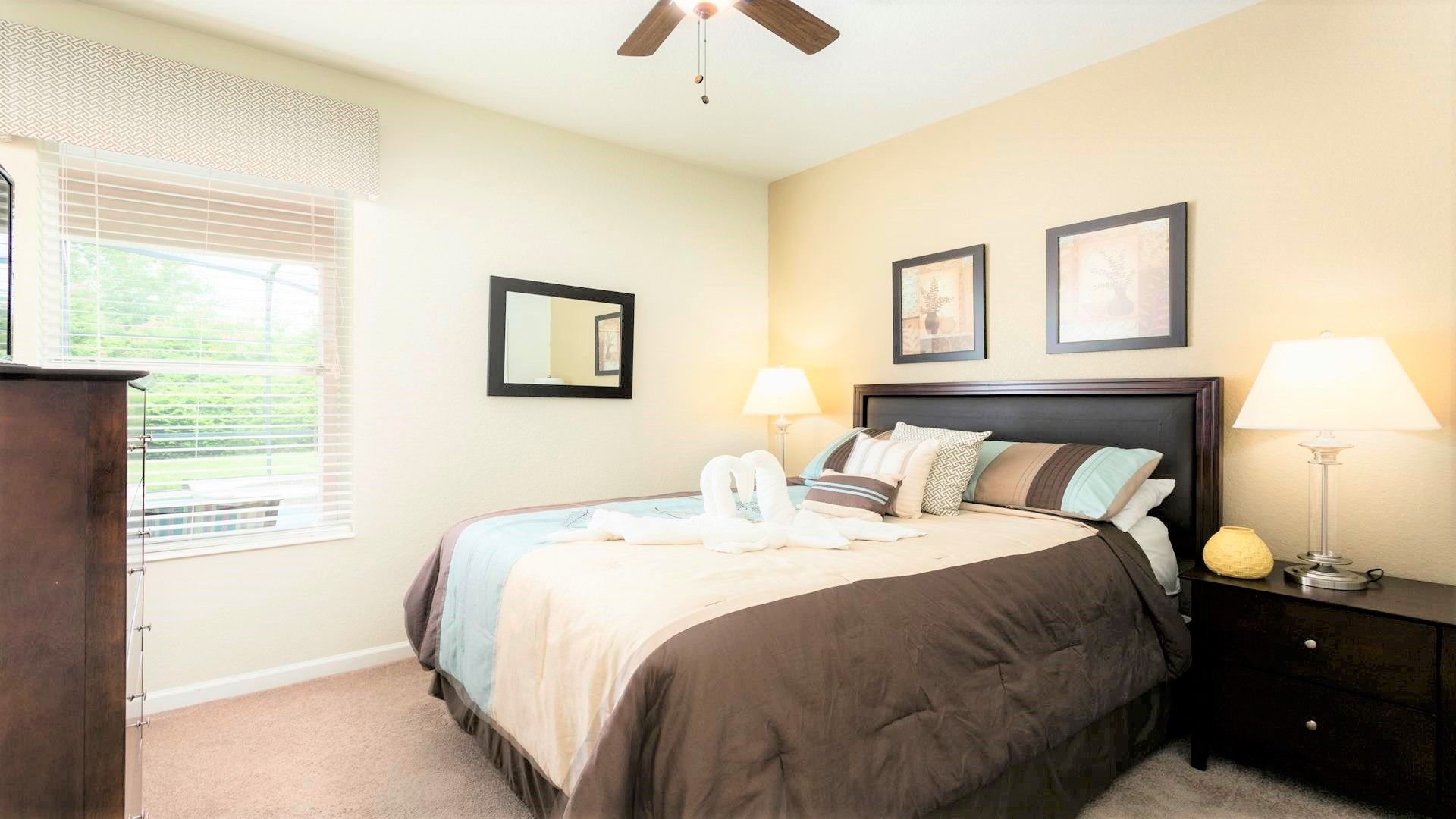 The spacious second bedroom with a comfortable queen bed