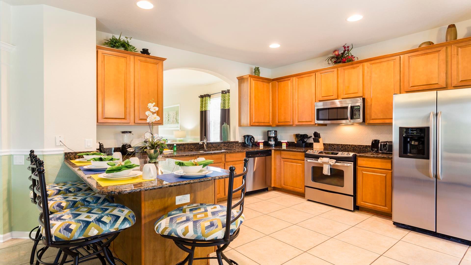 Dream kitchen awaits! Warm wood & stainless steel shine.