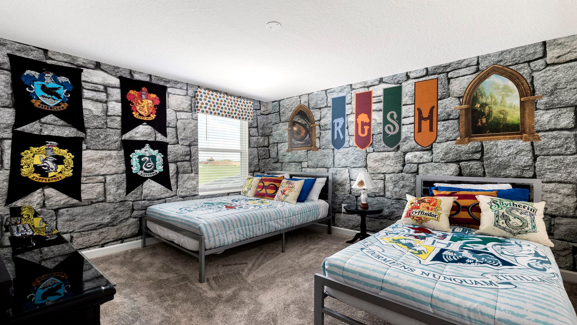 Magical Hogwarts-themed room with house banners and cozy twin beds