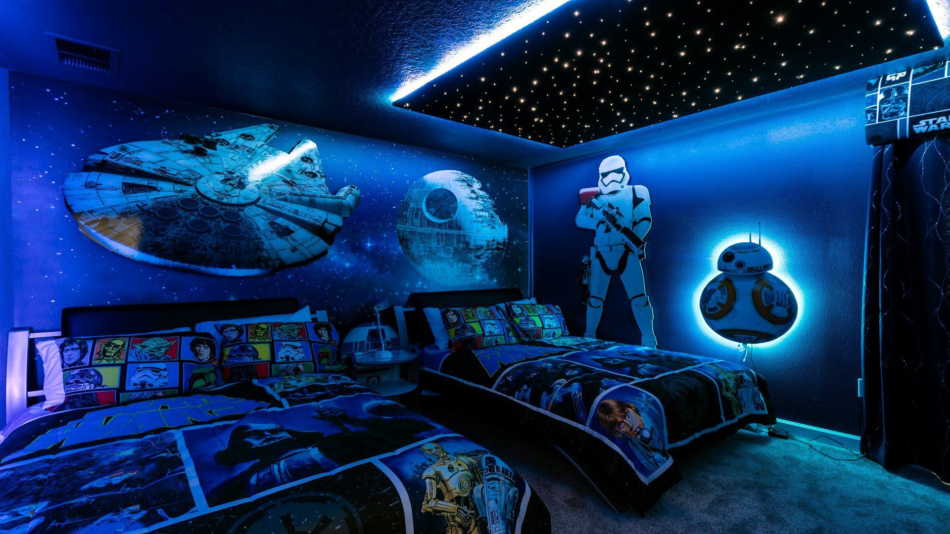 Epic Star Wars-themed room with glowing stars, murals, and twin beds