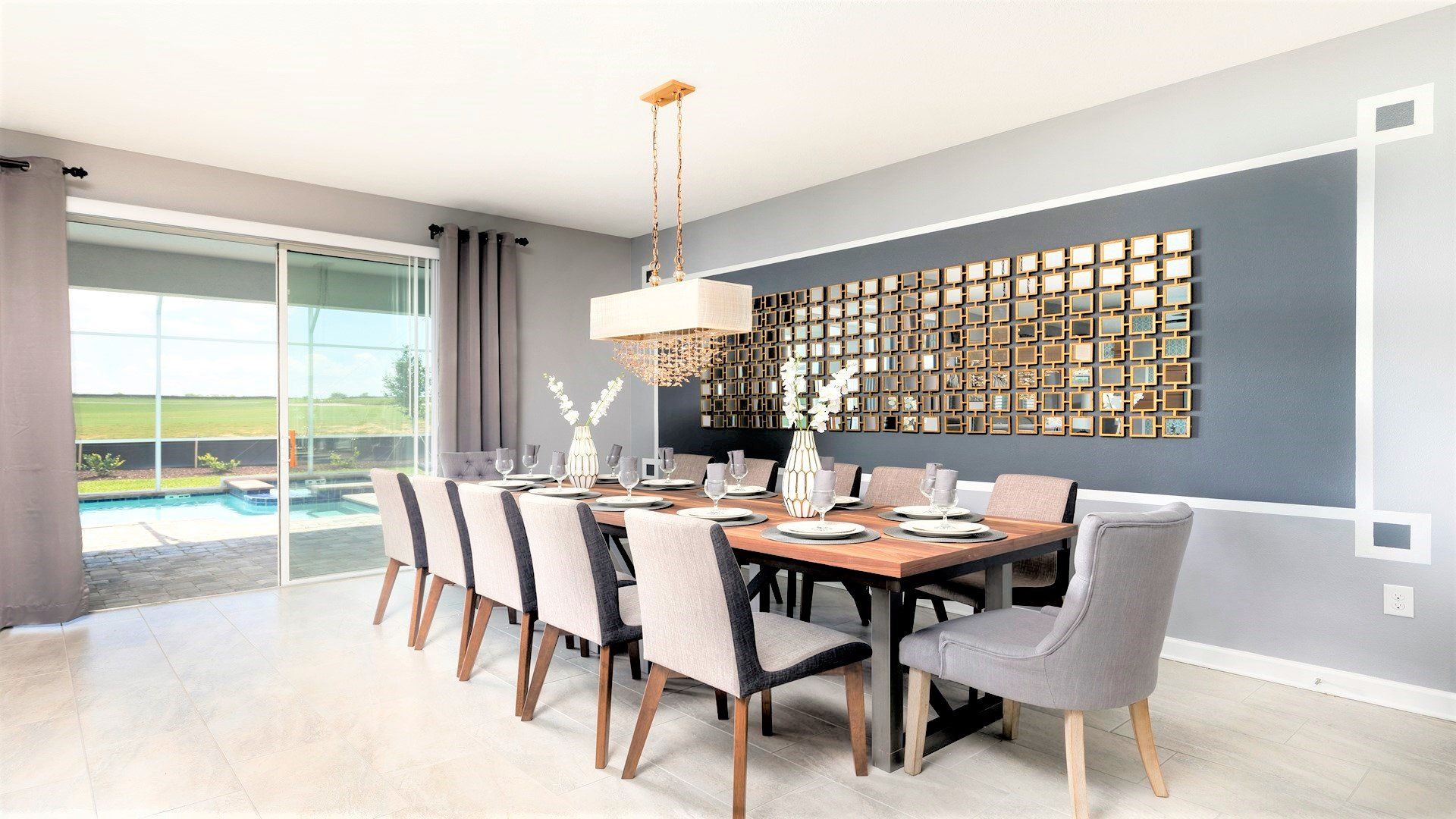 Elegant dining area with seating for 10, pool views, and modern decor