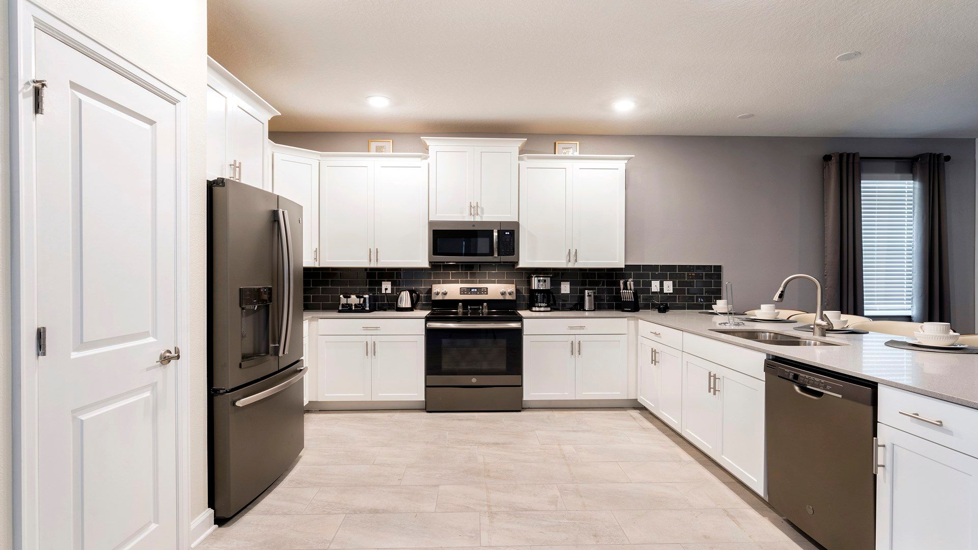 Fully equipped modern kitchen with sleek appliances and ample space