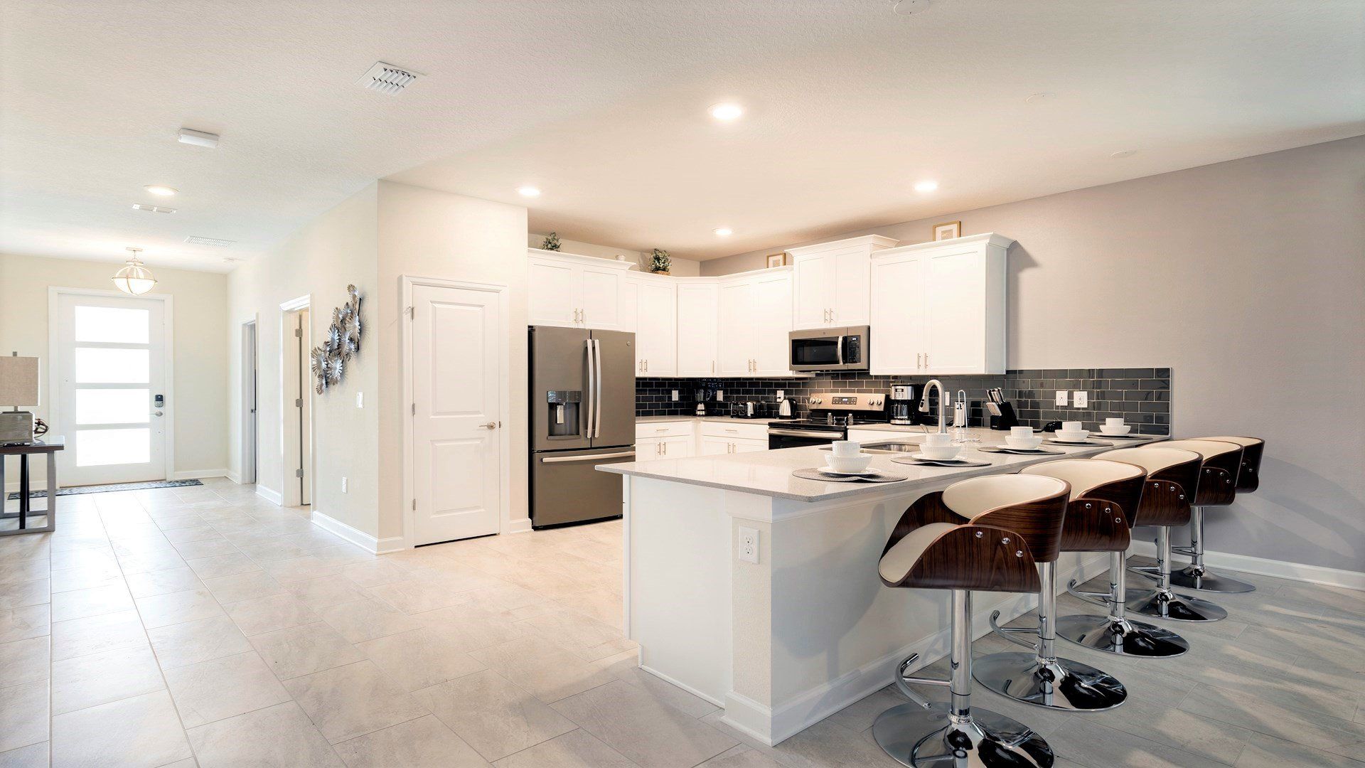 Open-concept kitchen with island seating, modern design, and style