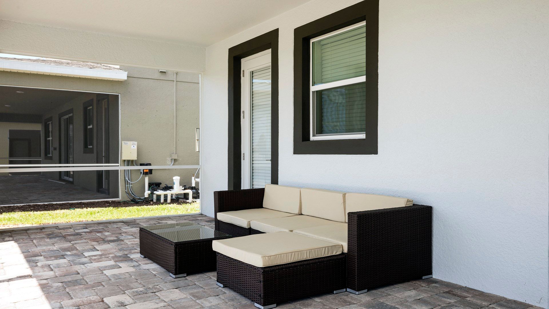 Relax on the stylish outdoor lounge set in a peaceful patio space