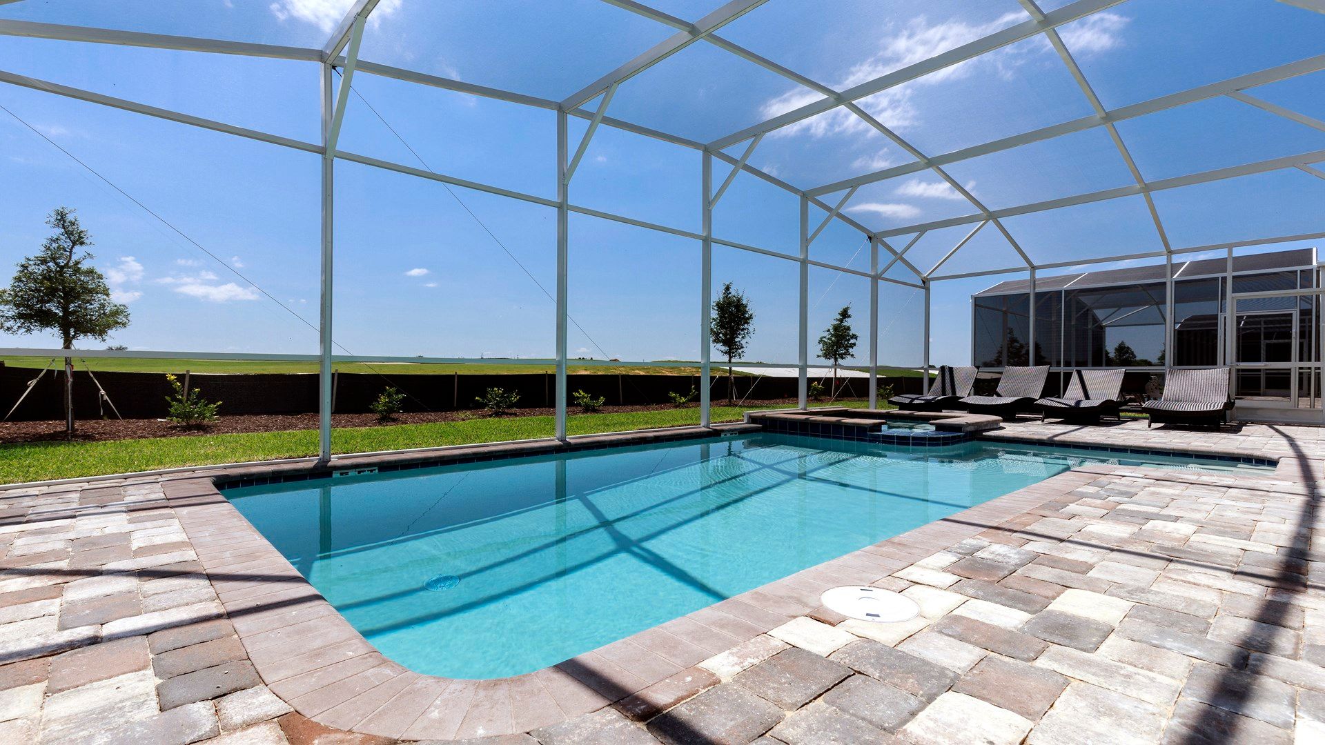 Relax by the screened private pool with sun loungers and open views