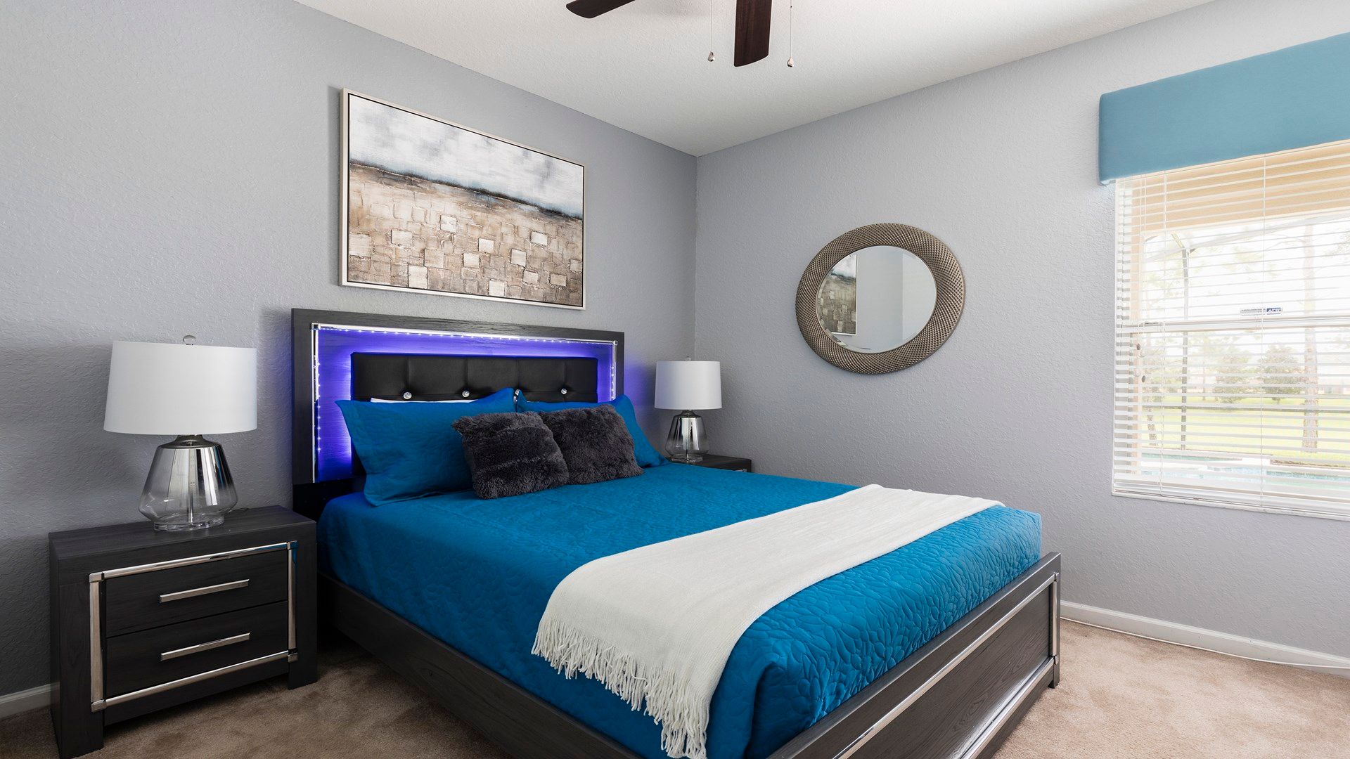 Stylish bedroom with LED-lit headboard, plush bedding, and relaxing vibes!
