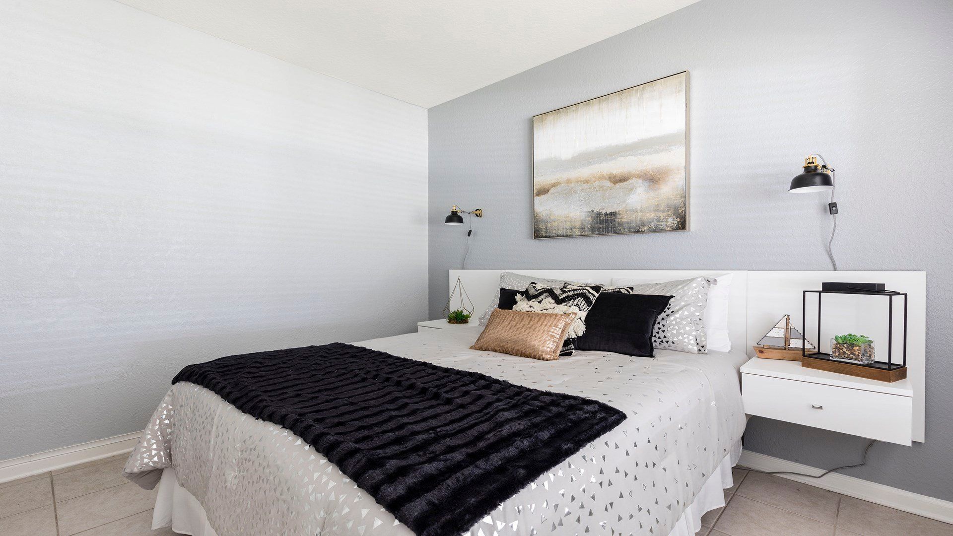 Modern and cozy bedroom with stylish decor, soft linens, and a relaxing ambiance!