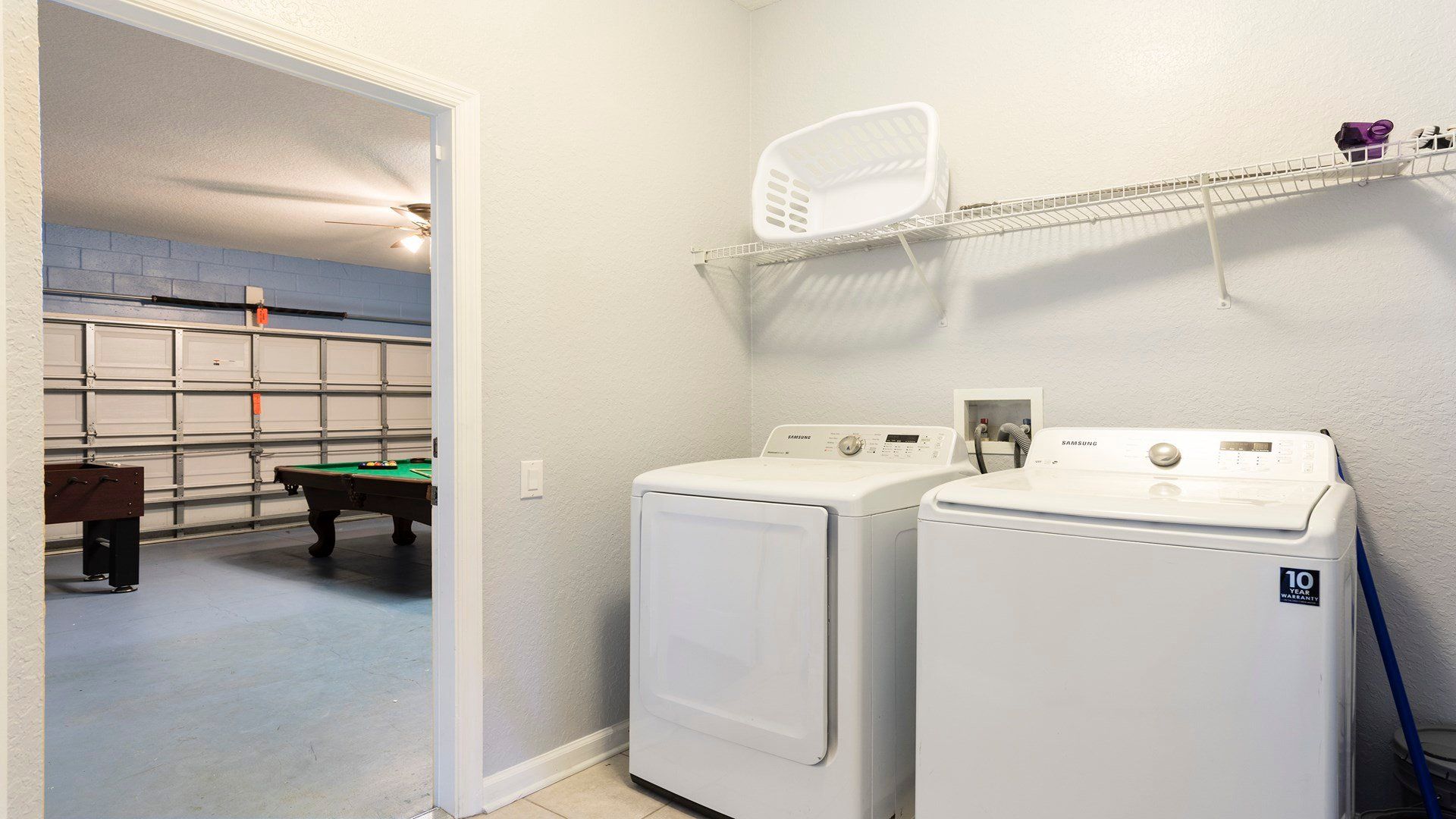 Convenient laundry room with modern appliances, plus easy access to the game room!