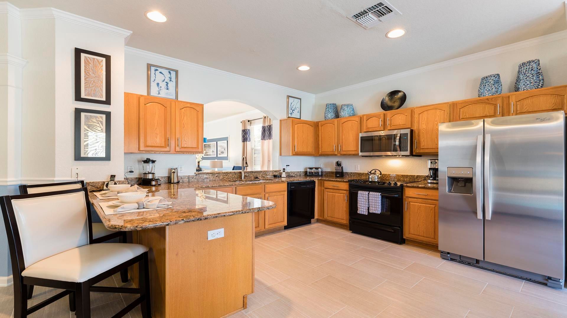 The large chef's kitchen comes equipped with everything you could need.