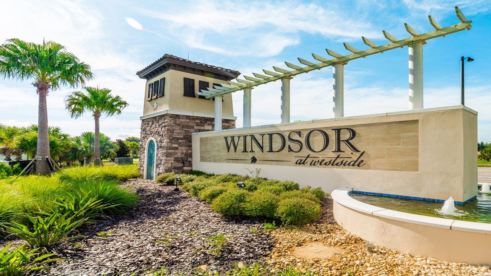 Elegant Windsor at Westside entrance with lush landscaping.
