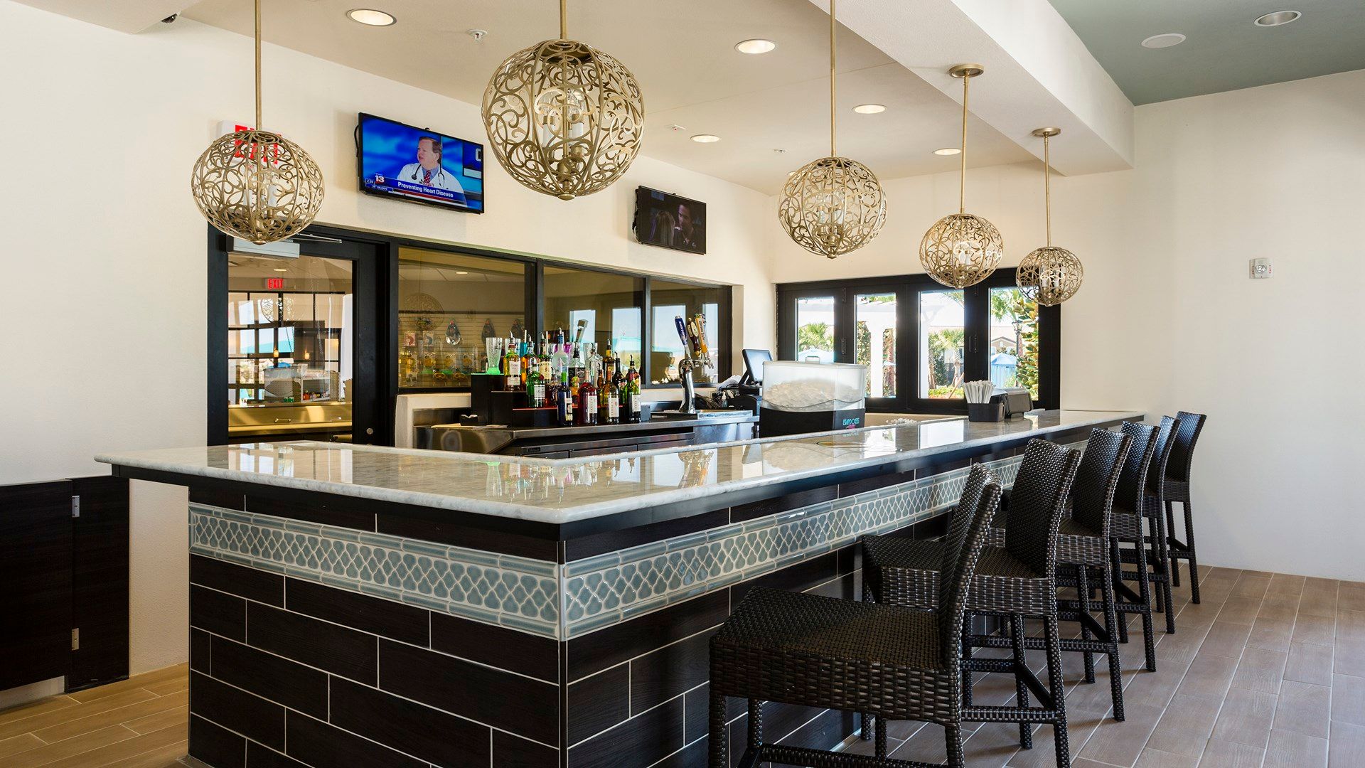 Chic clubhouse bar with modern decor and ample seating.