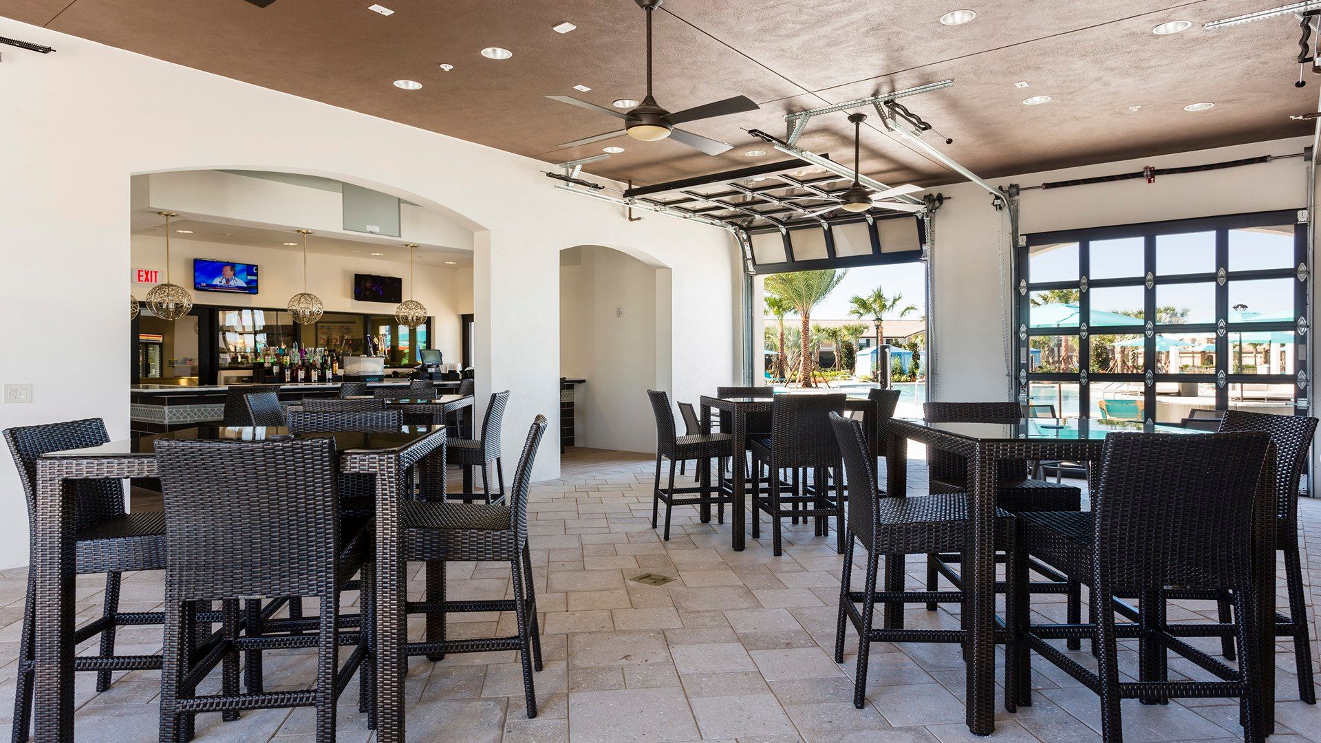 Chic clubhouse bar with modern decor and ample seating.