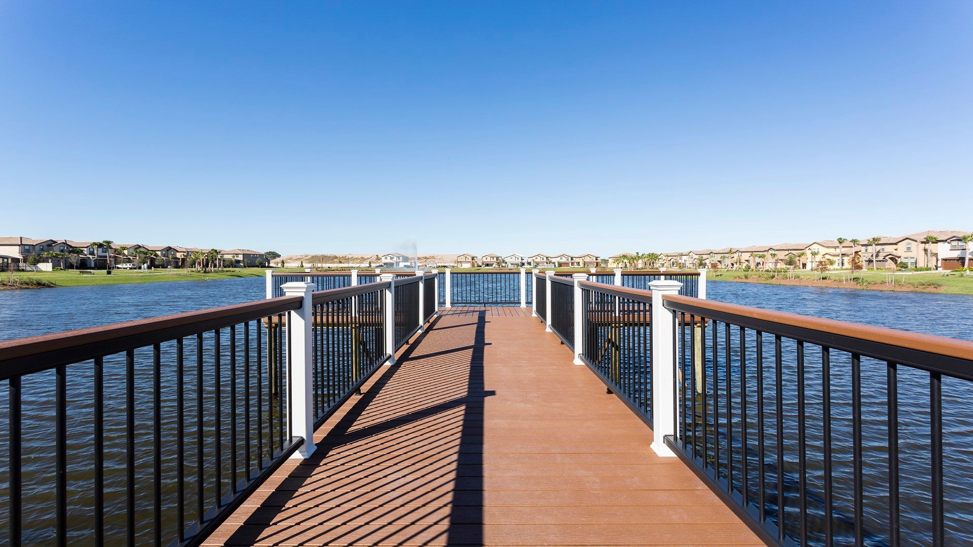 Scenic lakefront dock with picturesque water and community views