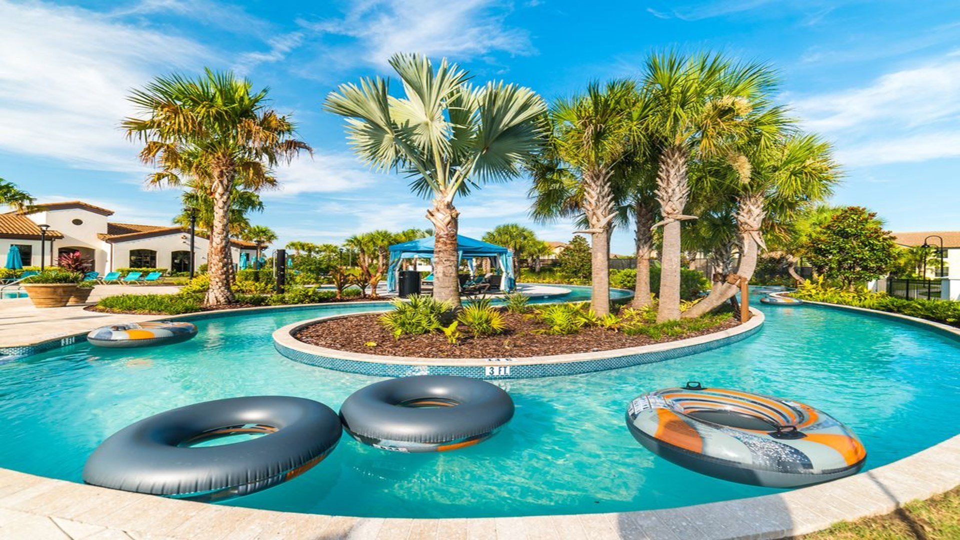 Float along the lazy river surrounded by lush greenery and cabanas.