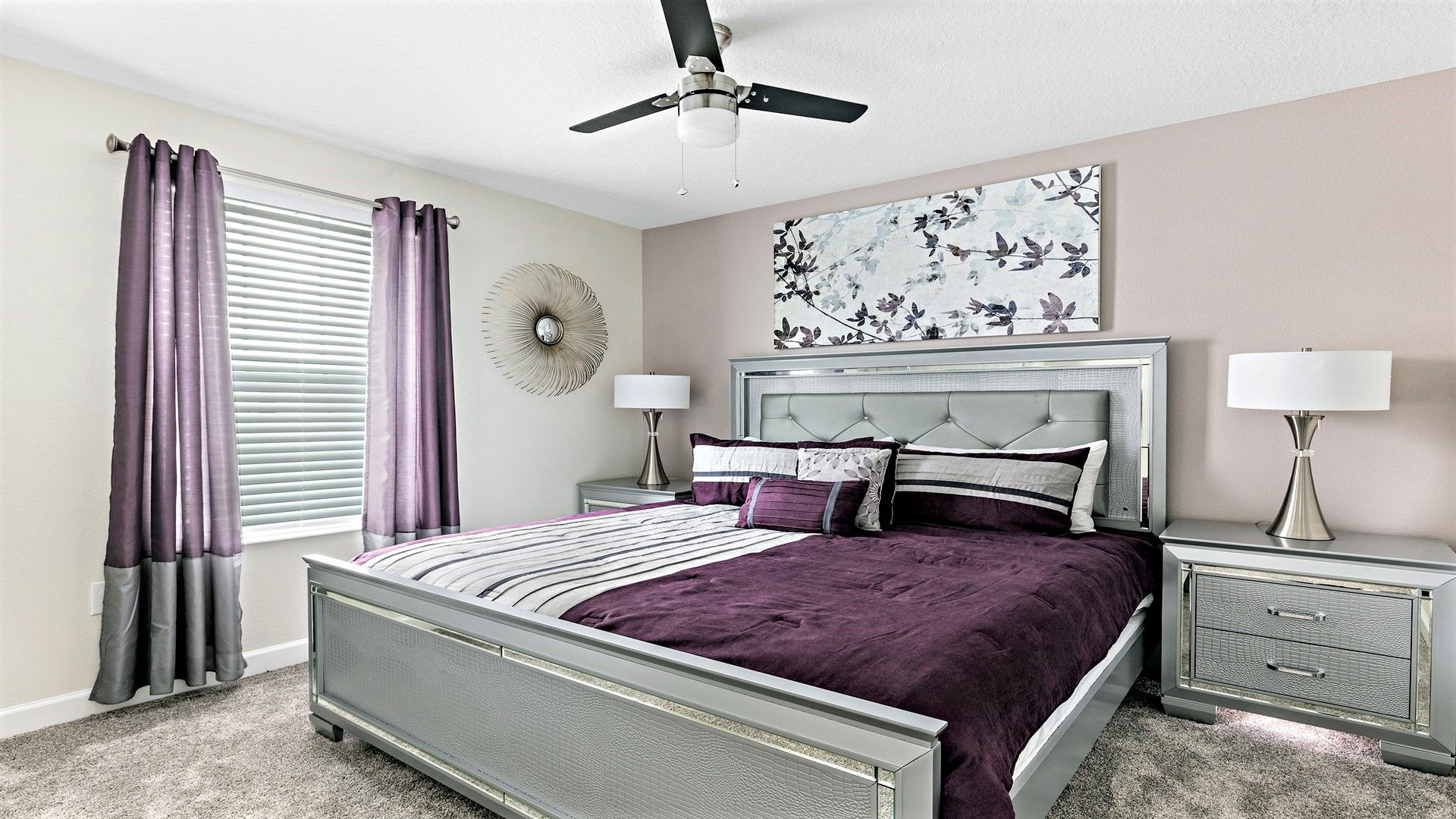 Luxurious bedroom with elegant decor, rich purple accents, and modern furnishings.