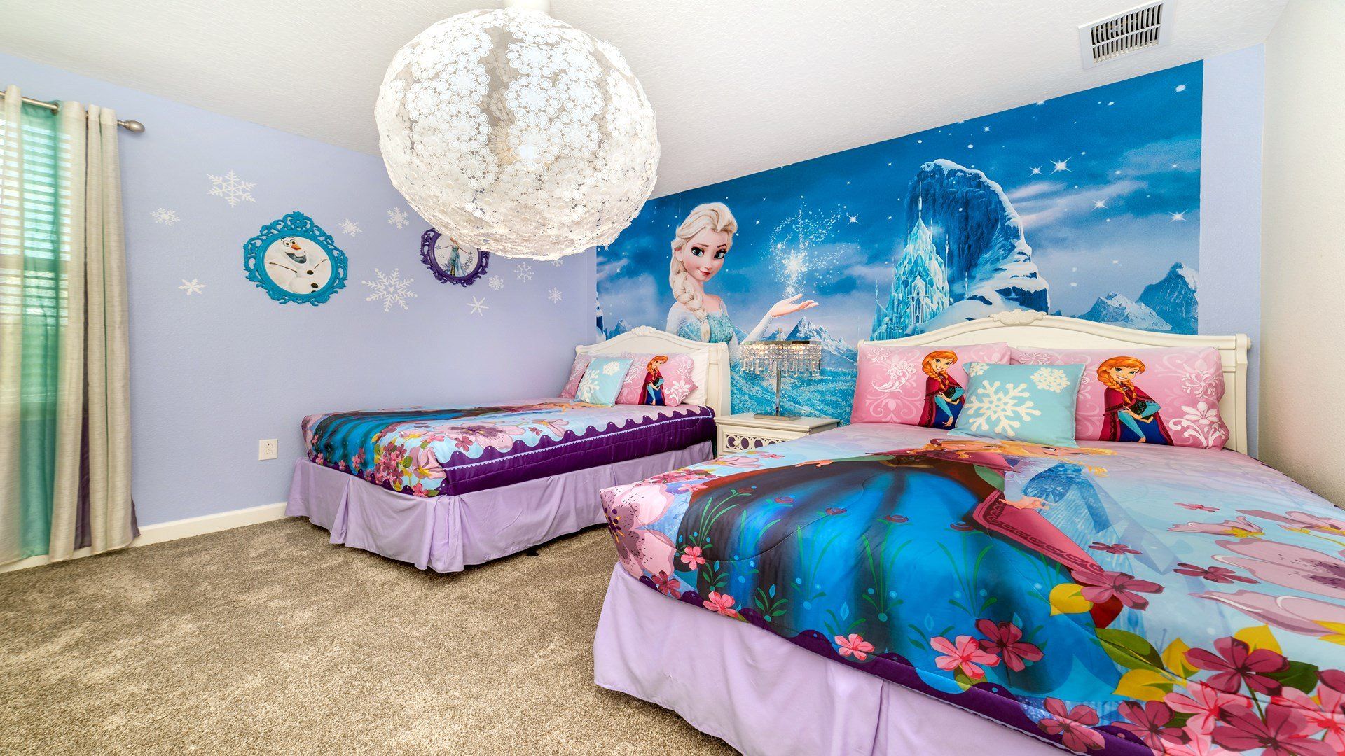 Enchanting Frozen-themed bedroom with twin beds and icy magic!