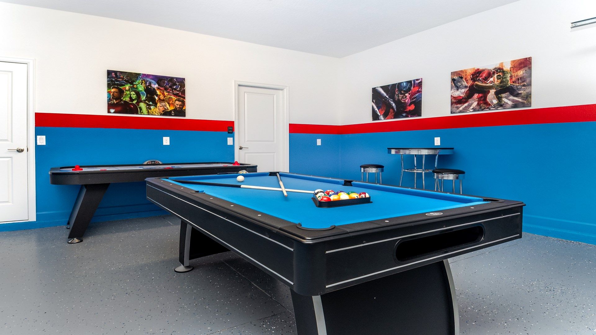 Action-packed game room with pool, air hockey, and superhero flair!