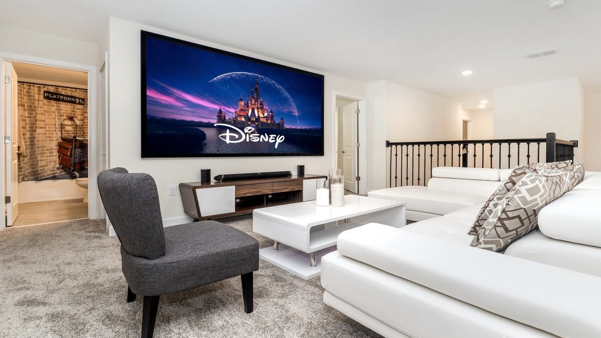 Enjoy movie nights on a huge screen in this cozy Disney-themed loft!