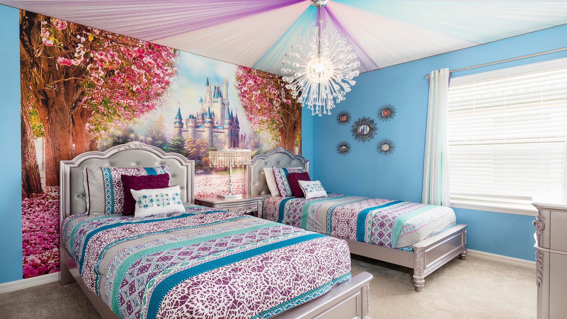Whimsical princess bedroom with castle mural, chic decor & twin beds!