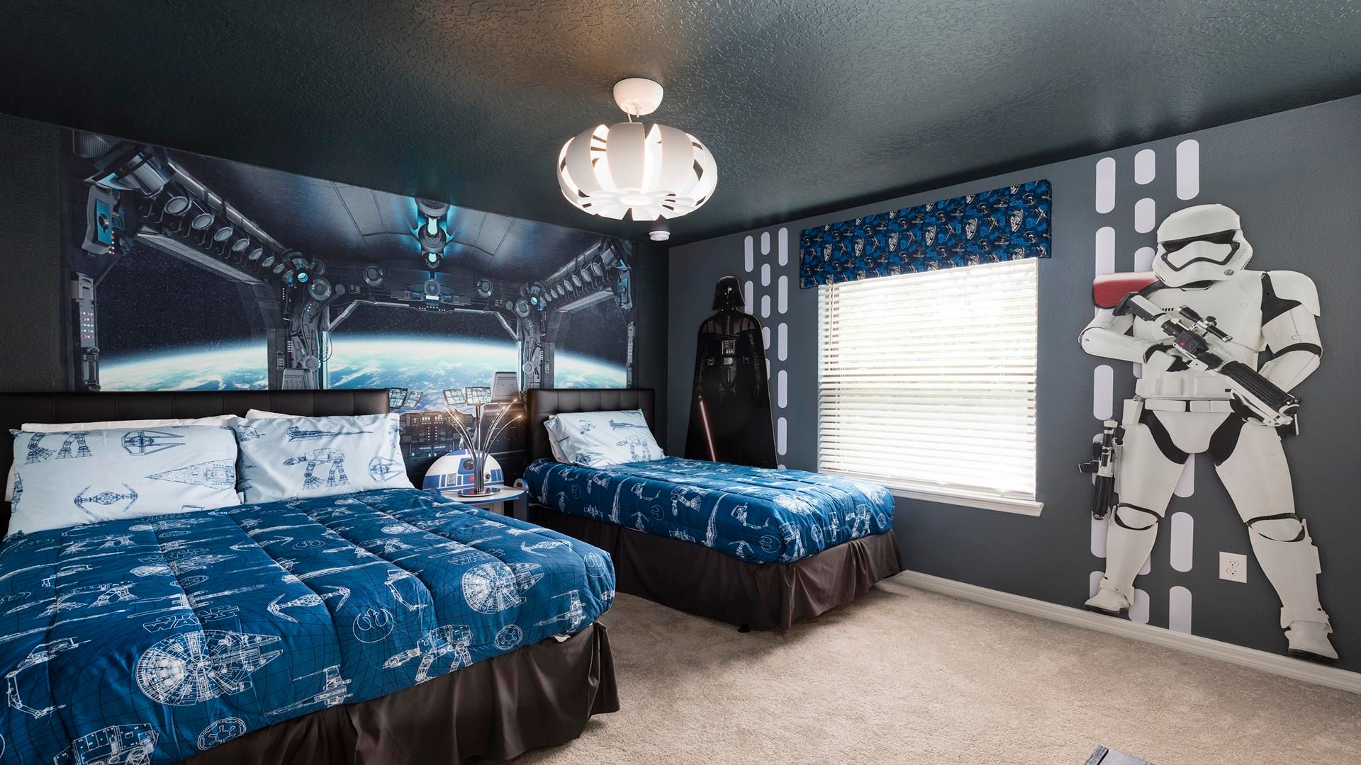 Space-themed twin bedroom with galactic decor and epic vibes!