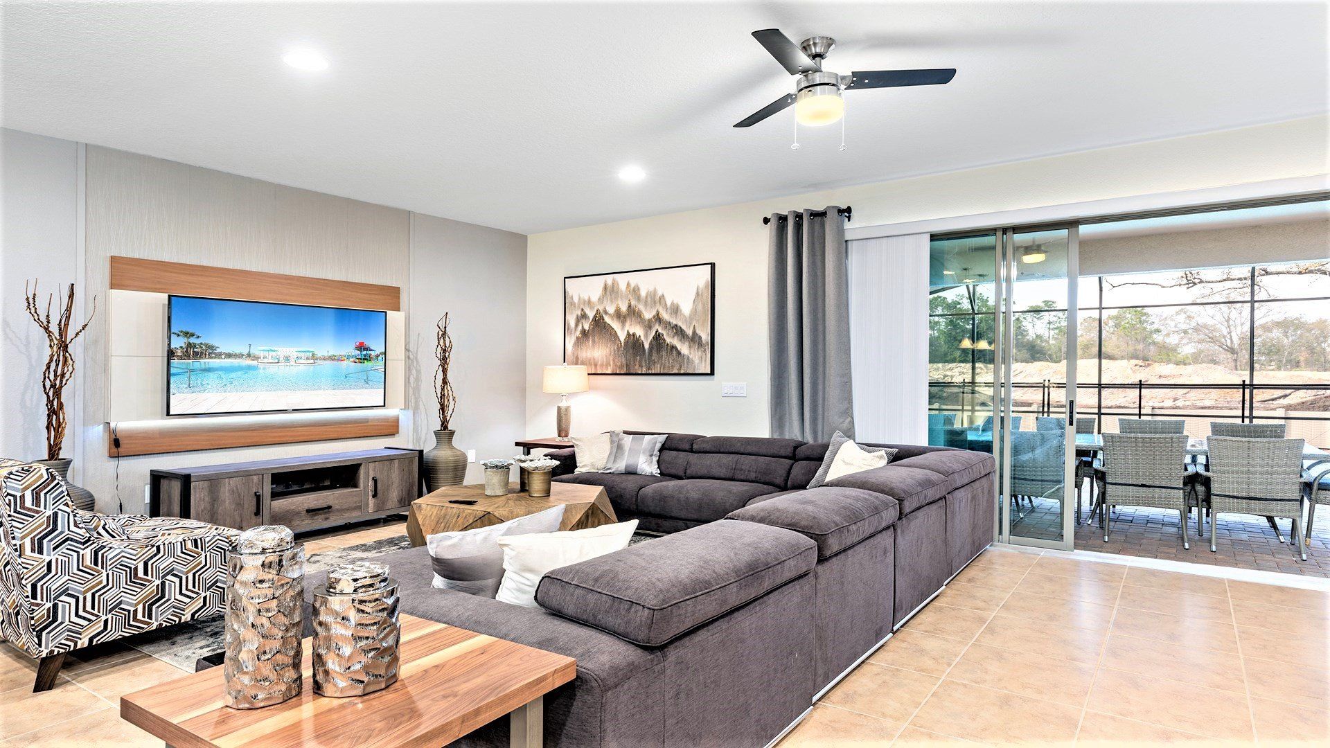 Stylish living area with sectional sofa, smart TV & patio access!