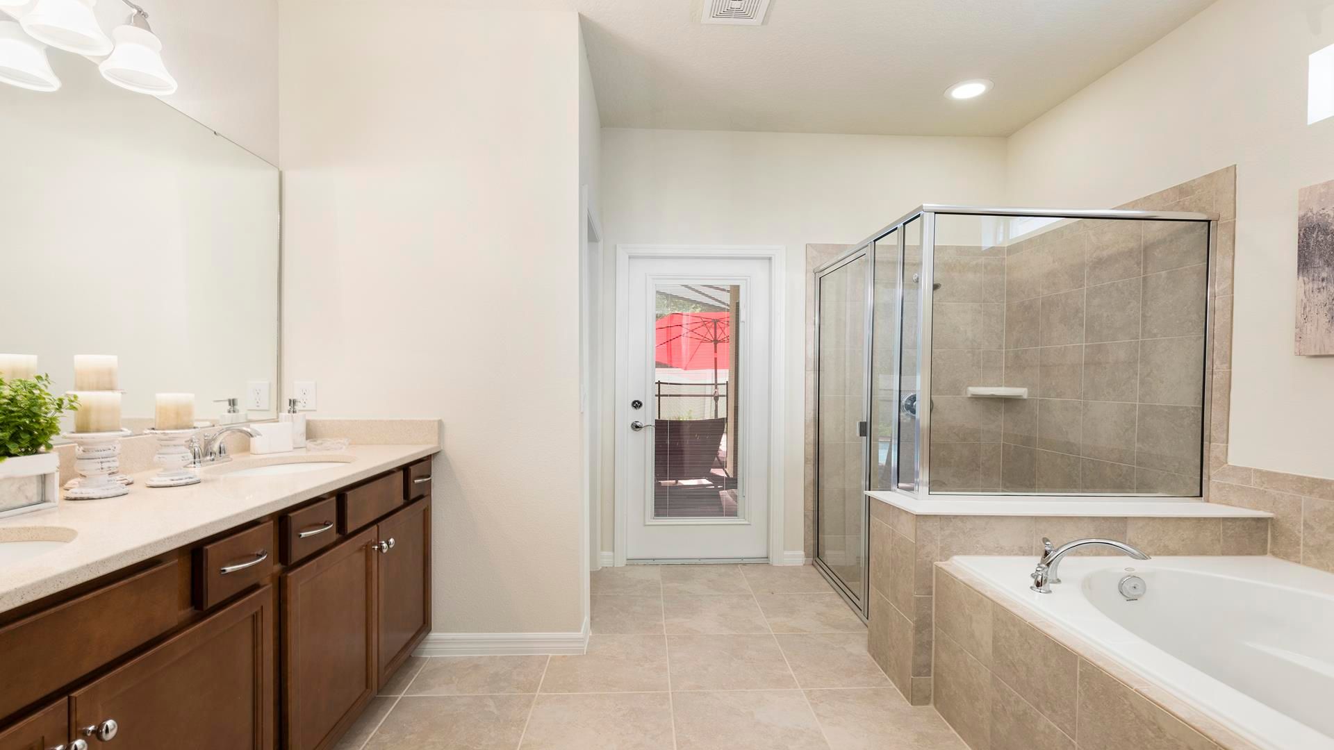 Spacious bathroom with dual sinks, walk-in shower, and soaking tub!