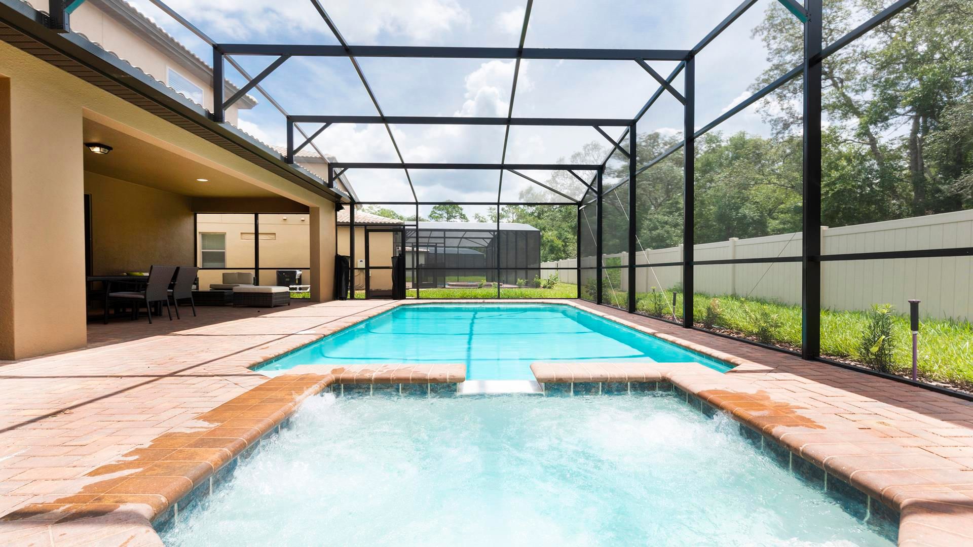 Private screened pool and spa with shaded patio for ultimate relaxation!