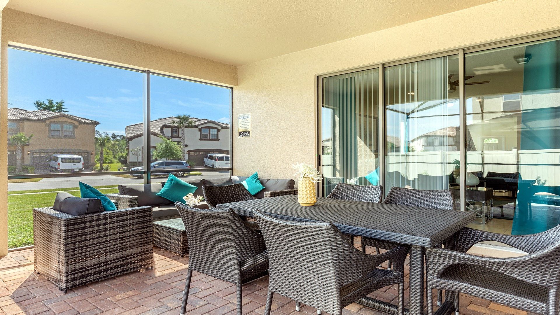 Relax in style on this covered patio with comfy seating and sunny neighborhood views.