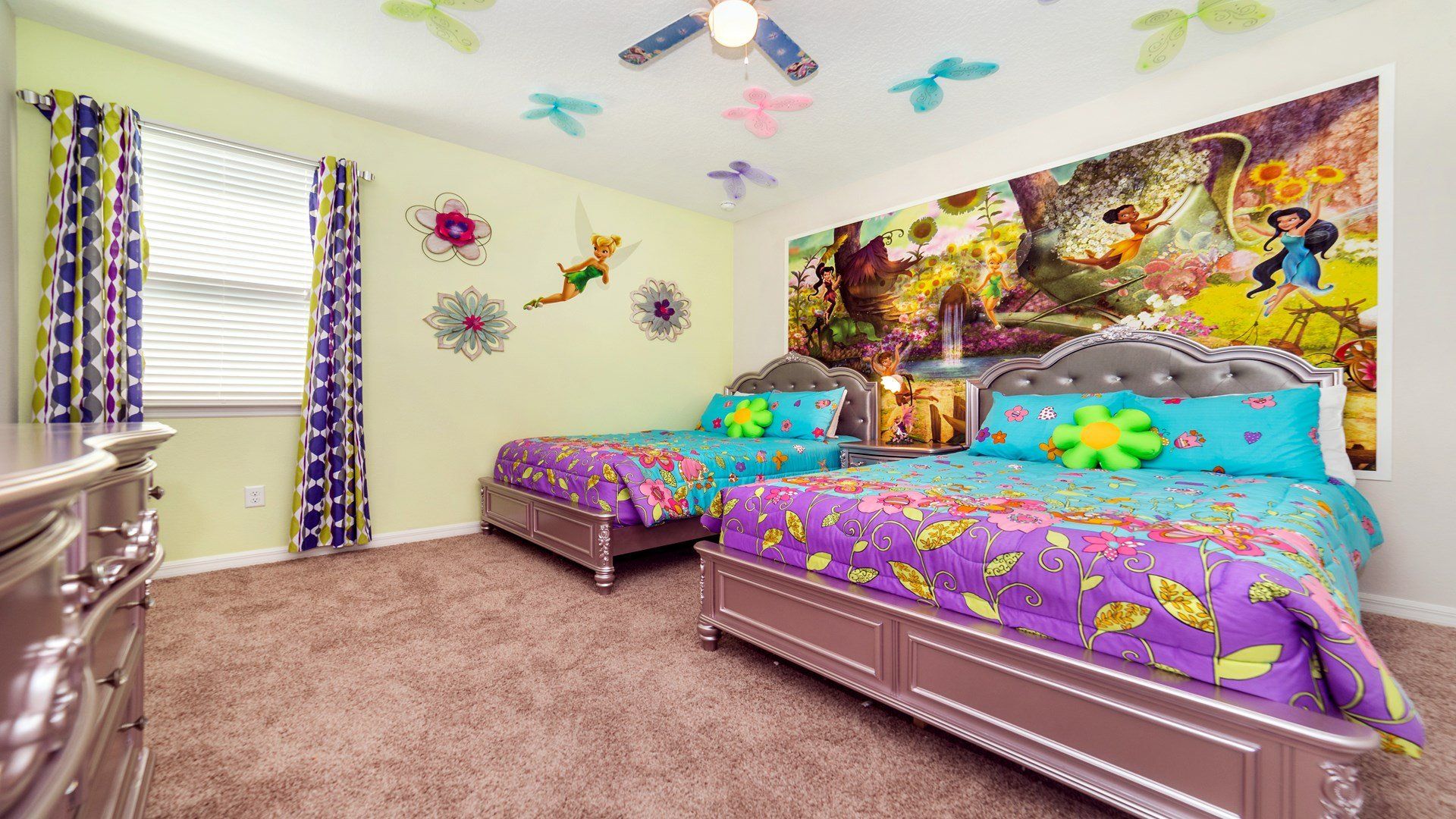 Elevate your children's delight with the enchanting upstairs bedroom, adorned with a captivating fairy theme that sparks their imagination.