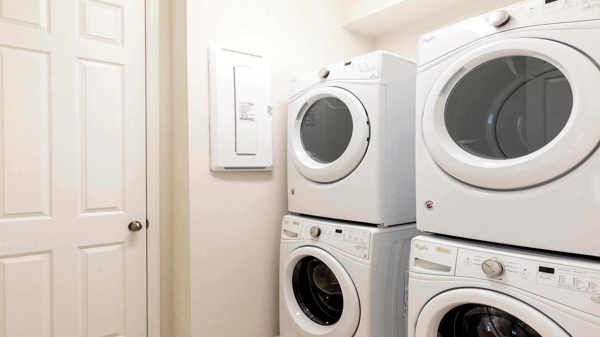 Convenience meets functionality with a dedicated washer and dryer room, streamlining your daily routines and providing a practical space for laundry tasks.