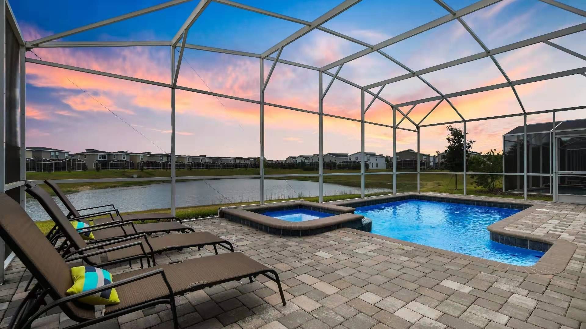 Relax by the private pool and spa with serene lake views.