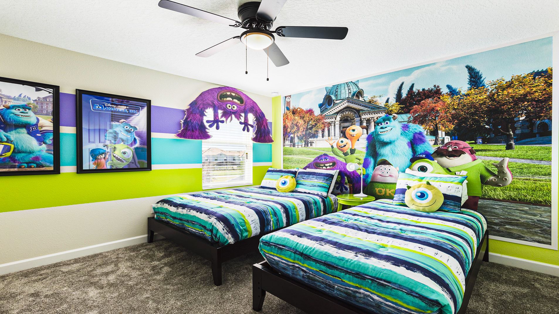 Fun Monsters-themed bedroom with twin beds, colorful decor, and character murals—perfect for kids!