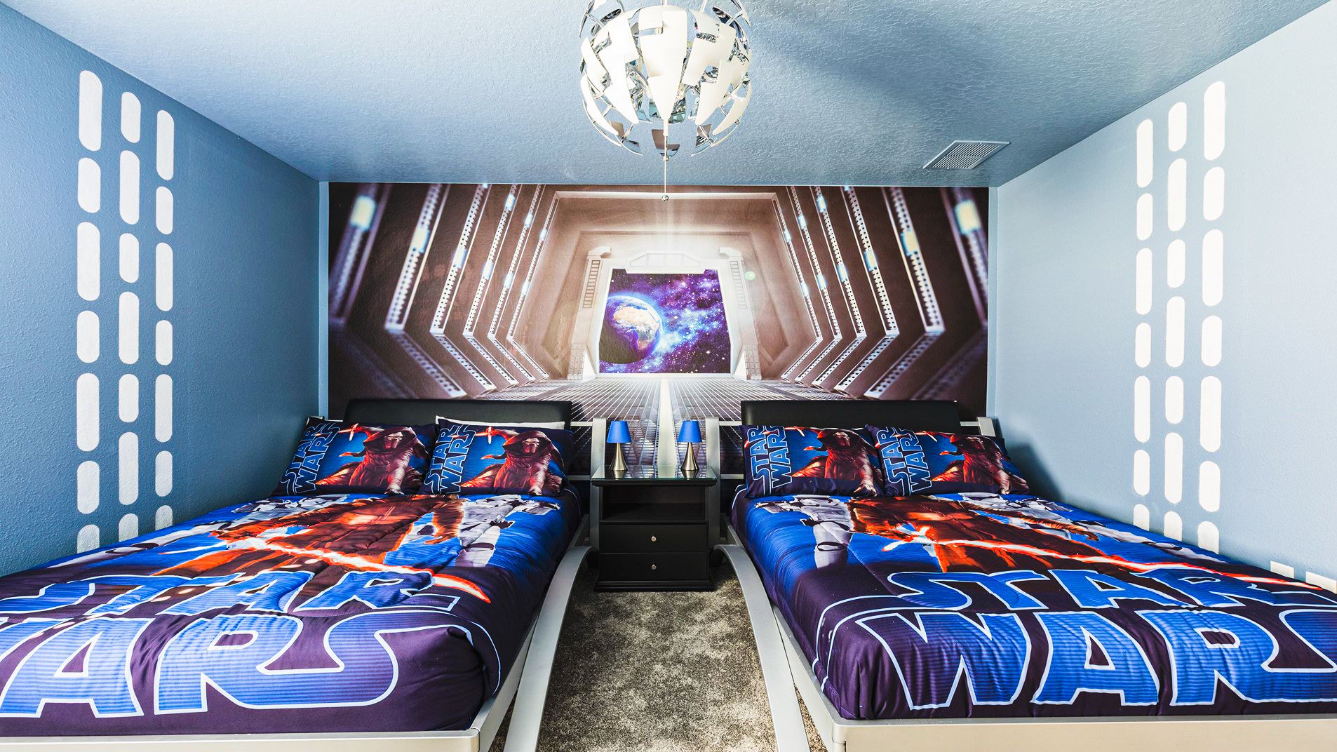 Epic Star Wars-themed bedroom with twin beds and galactic decor—perfect for young Jedi fans!