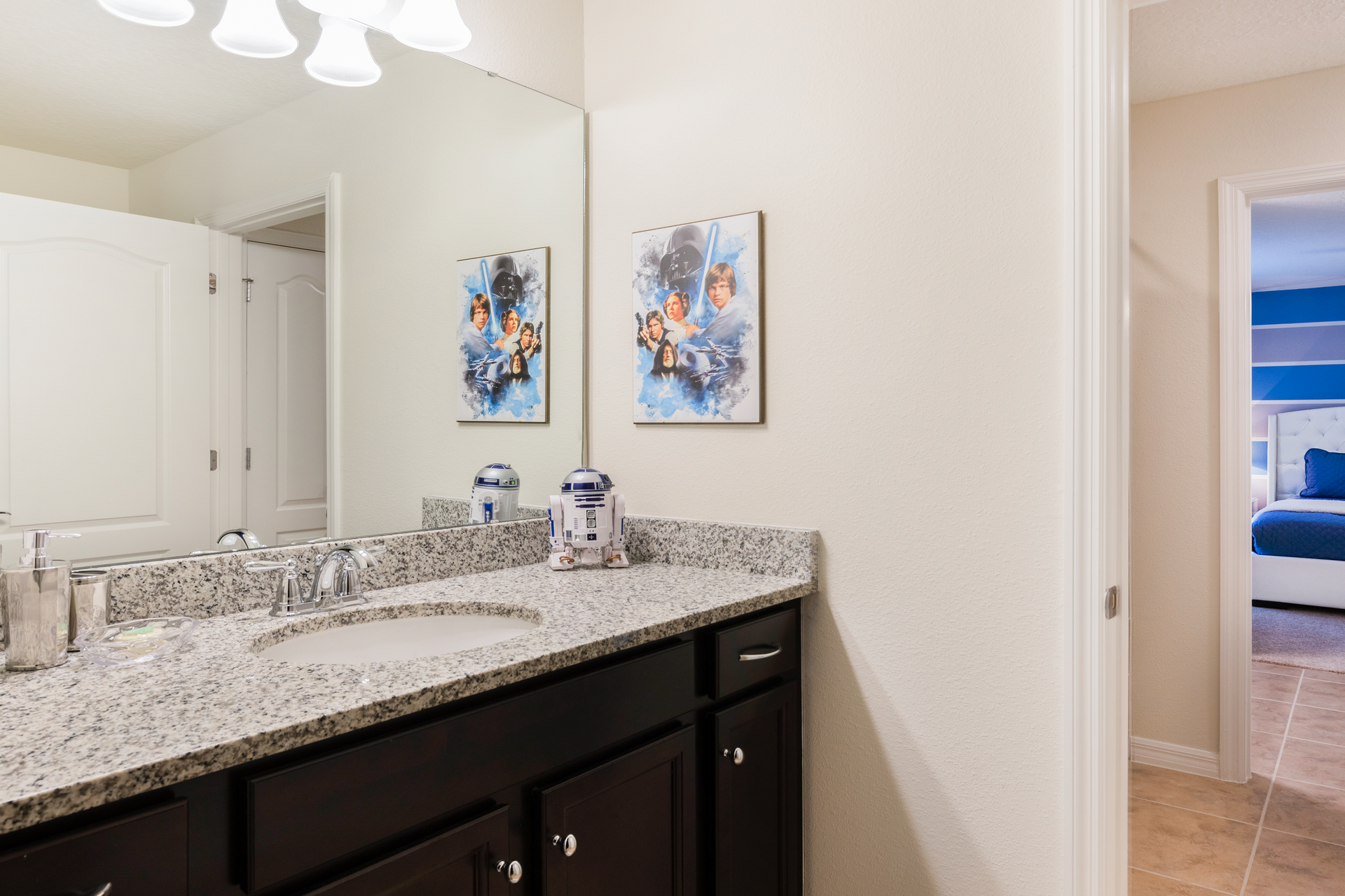 Galaxy-themed bathroom with granite counters and fun sci-fi touches for all ages.