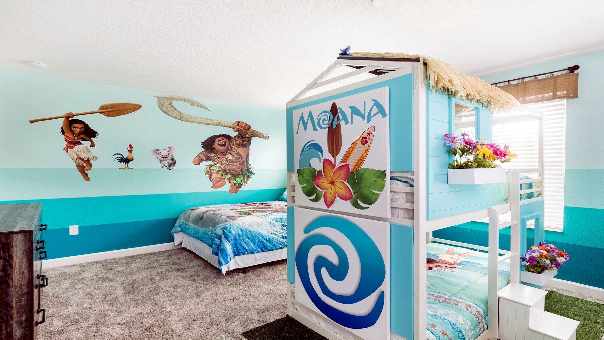 Moana-themed kids' room with fun bunk bed, vibrant decor, and cozy vibes.