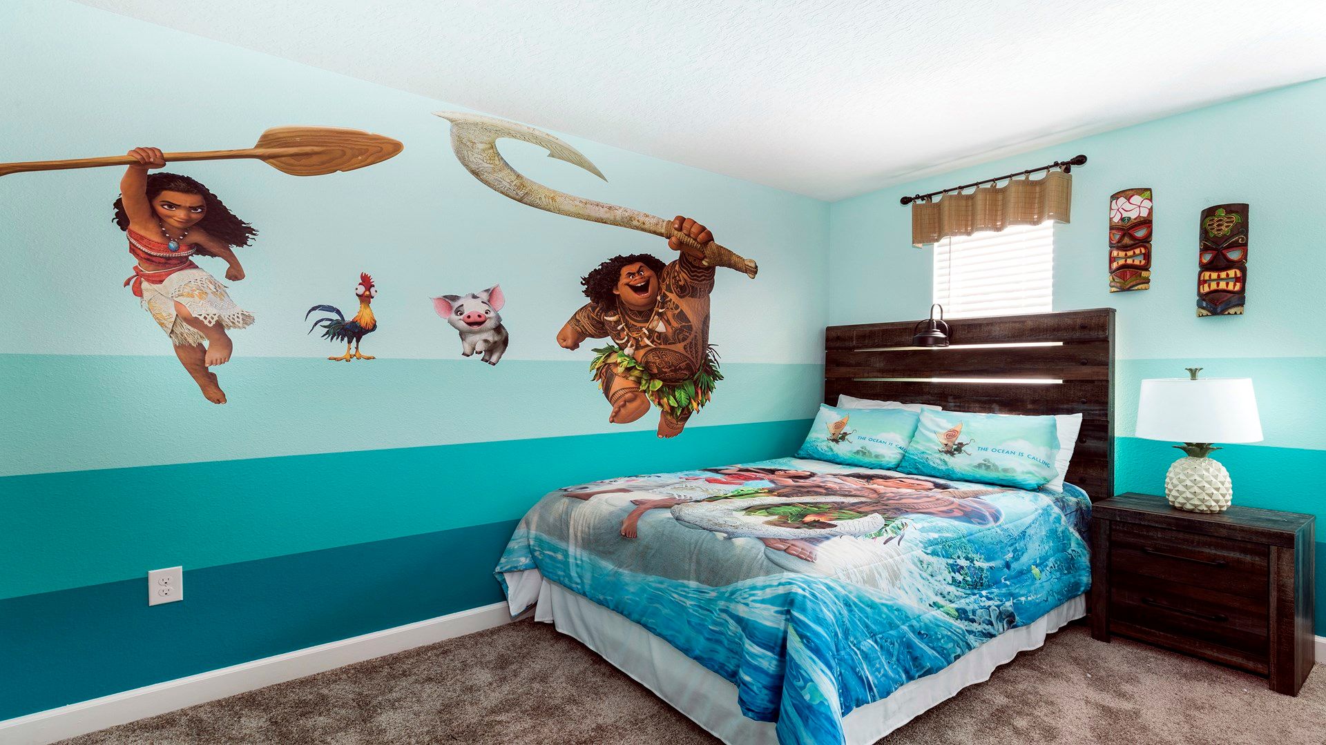 Moana-inspired bedroom with tropical vibes, colorful decor, and cozy bedding.