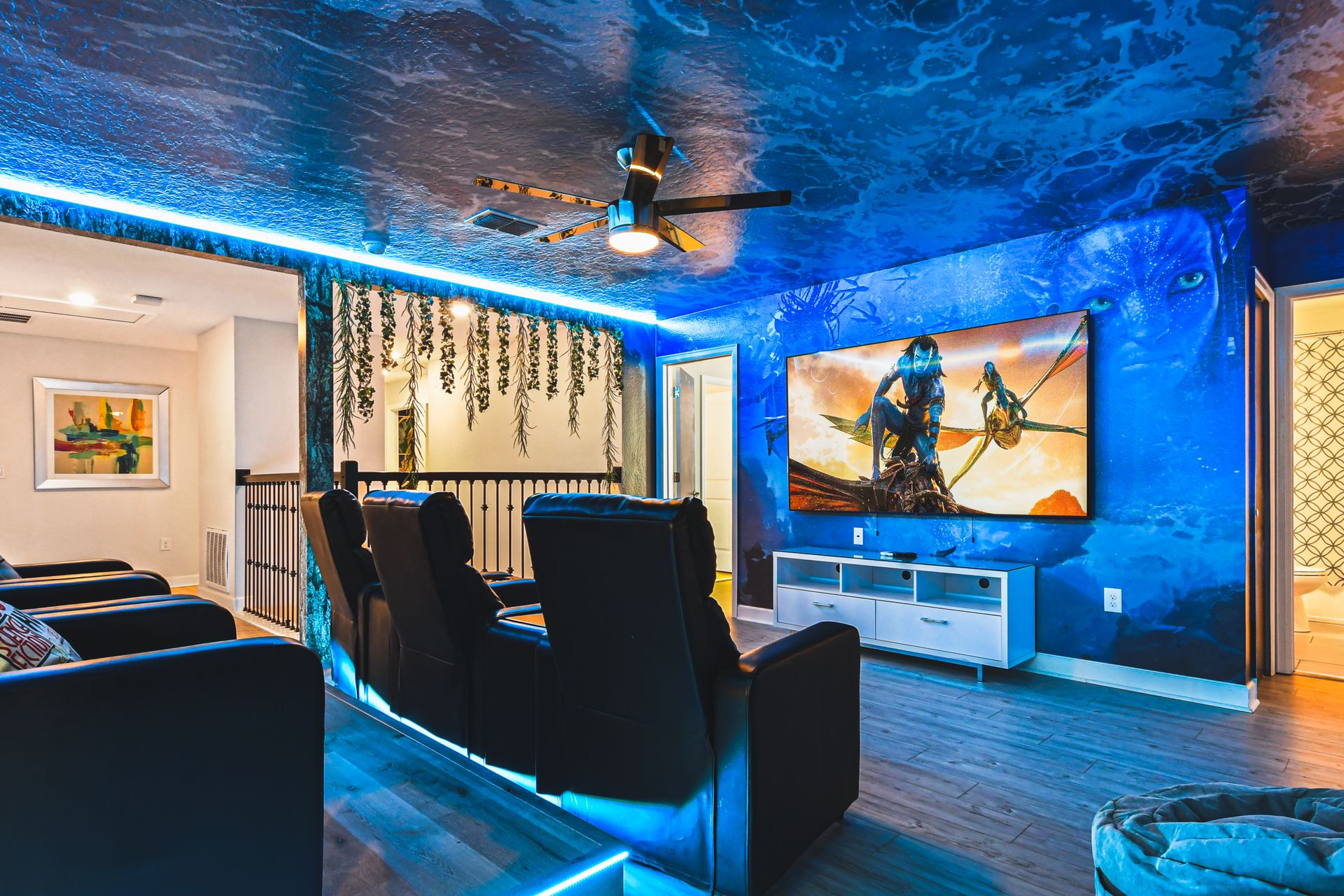 Avatar-themed theater room, immersed in water-inspired ambiance