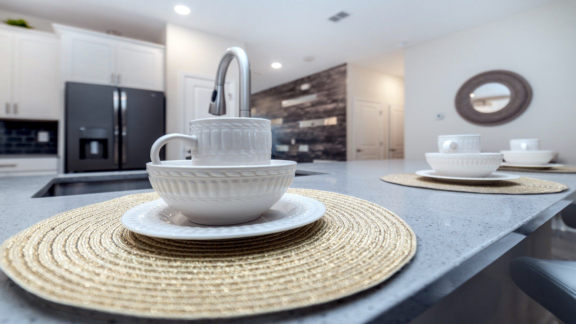 Modern kitchen with sleek countertops, elegant tableware, and style!